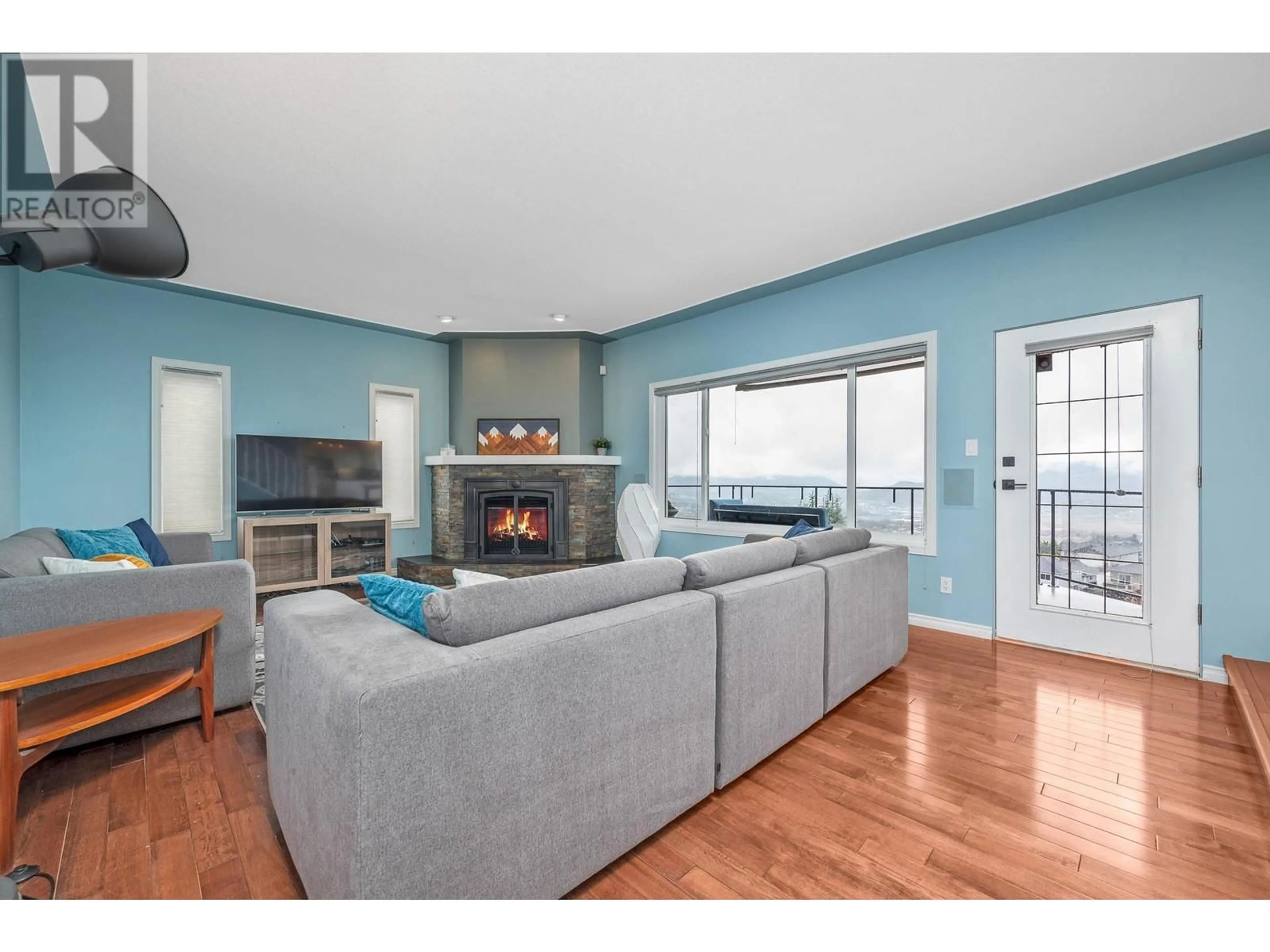 Living room with furniture, wood/laminate floor for 308 SUNSHINE PLACE, Vernon British Columbia V1B2Y3
