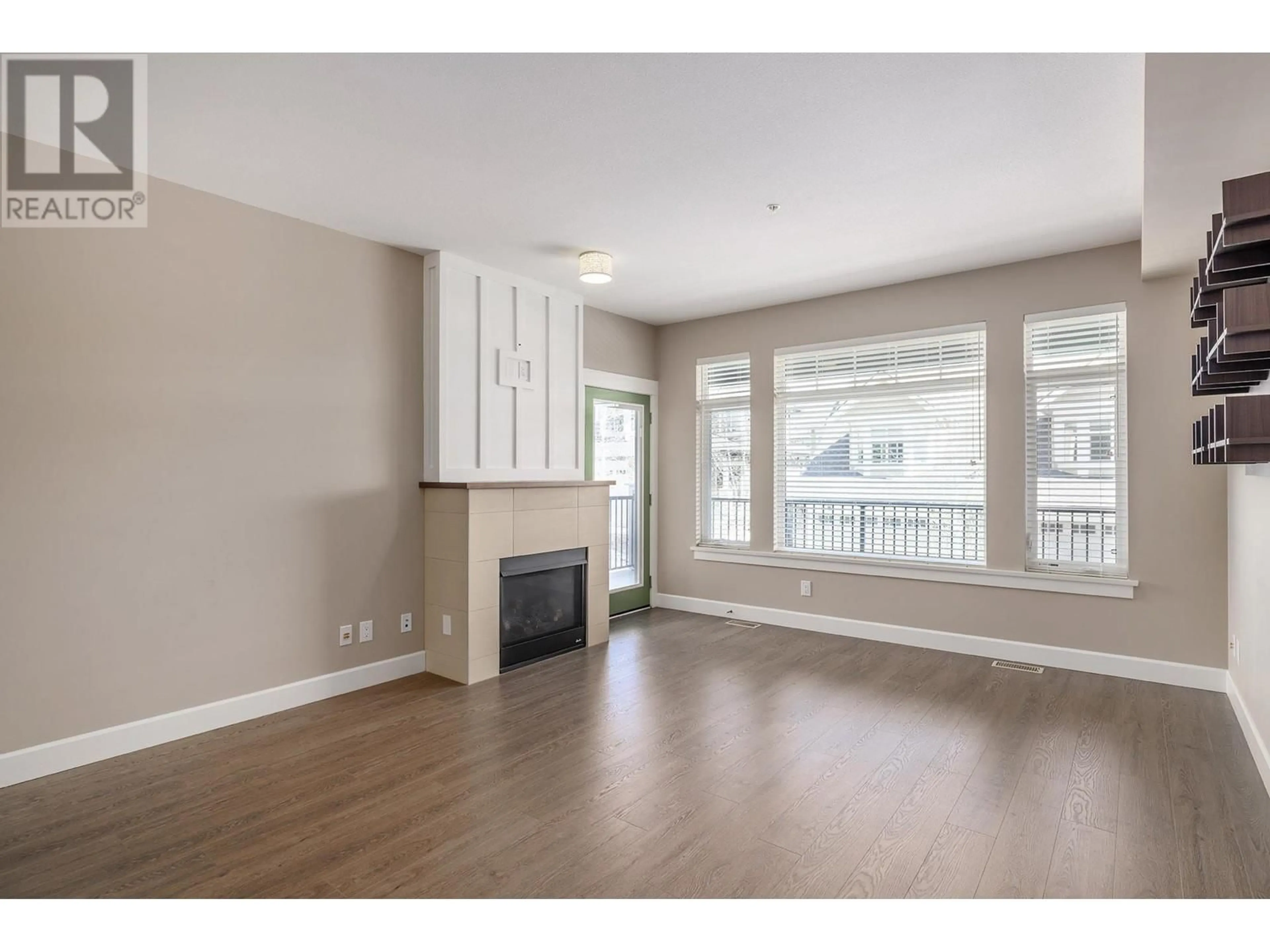 Living room with furniture, wood/laminate floor for 65 - 12850 STILLWATER COURT, Lake Country British Columbia V4V2S9