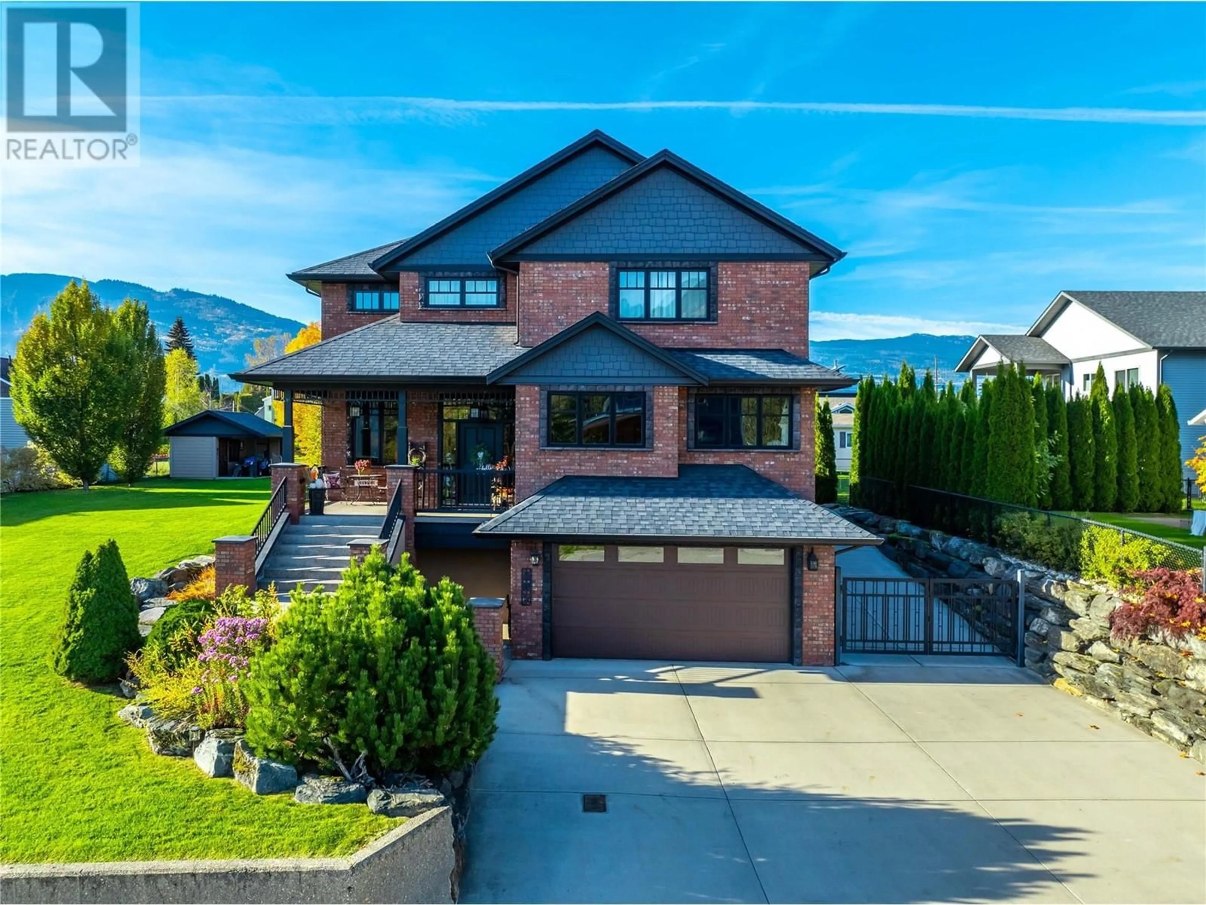 Home with brick exterior material, mountain view for 905 EDWARD STREET, Revelstoke British Columbia V0E2S0