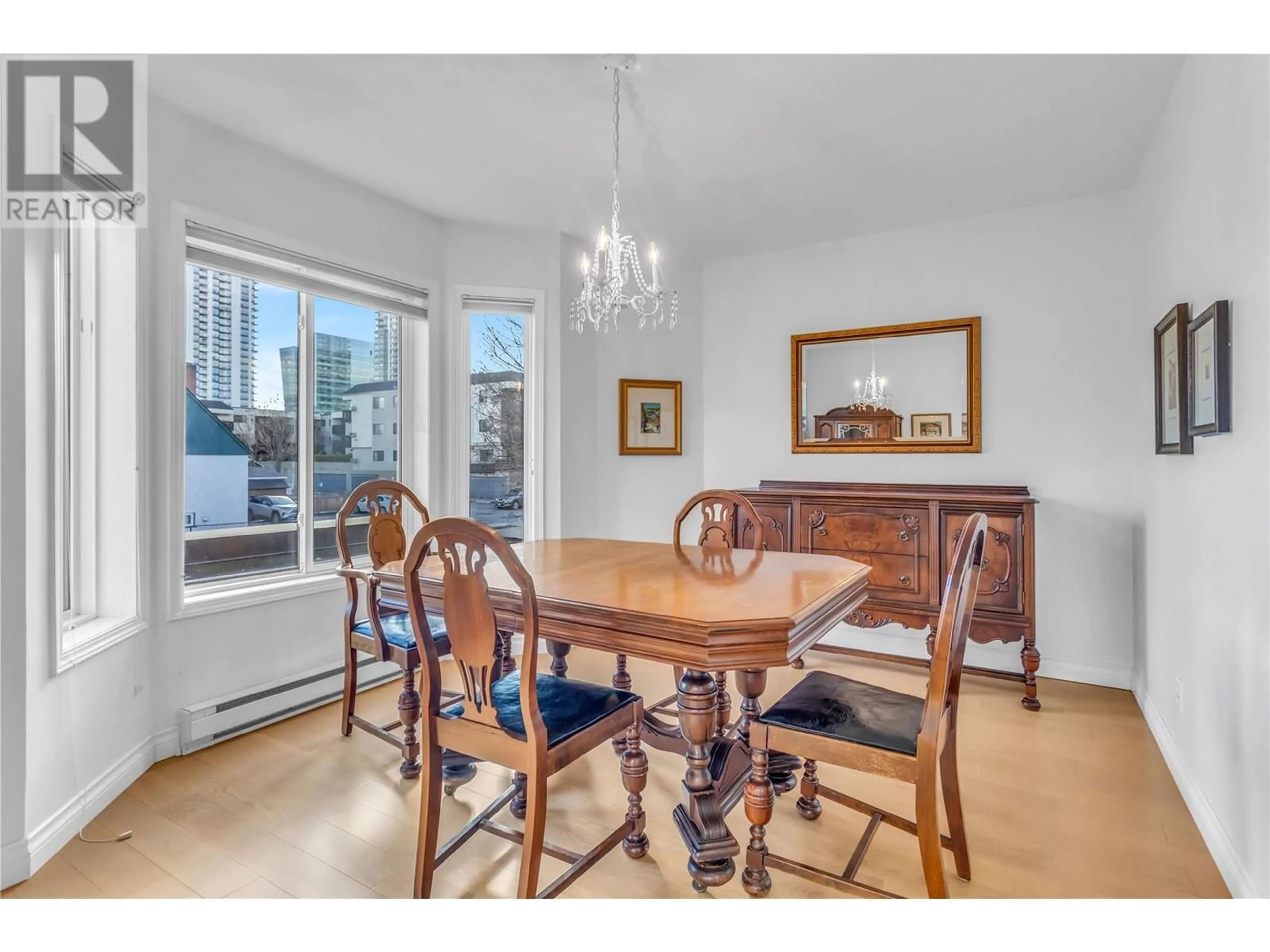 Dining room, wood/laminate floor for 101 - 680 DOYLE AVENUE, Kelowna British Columbia V1Y9S2