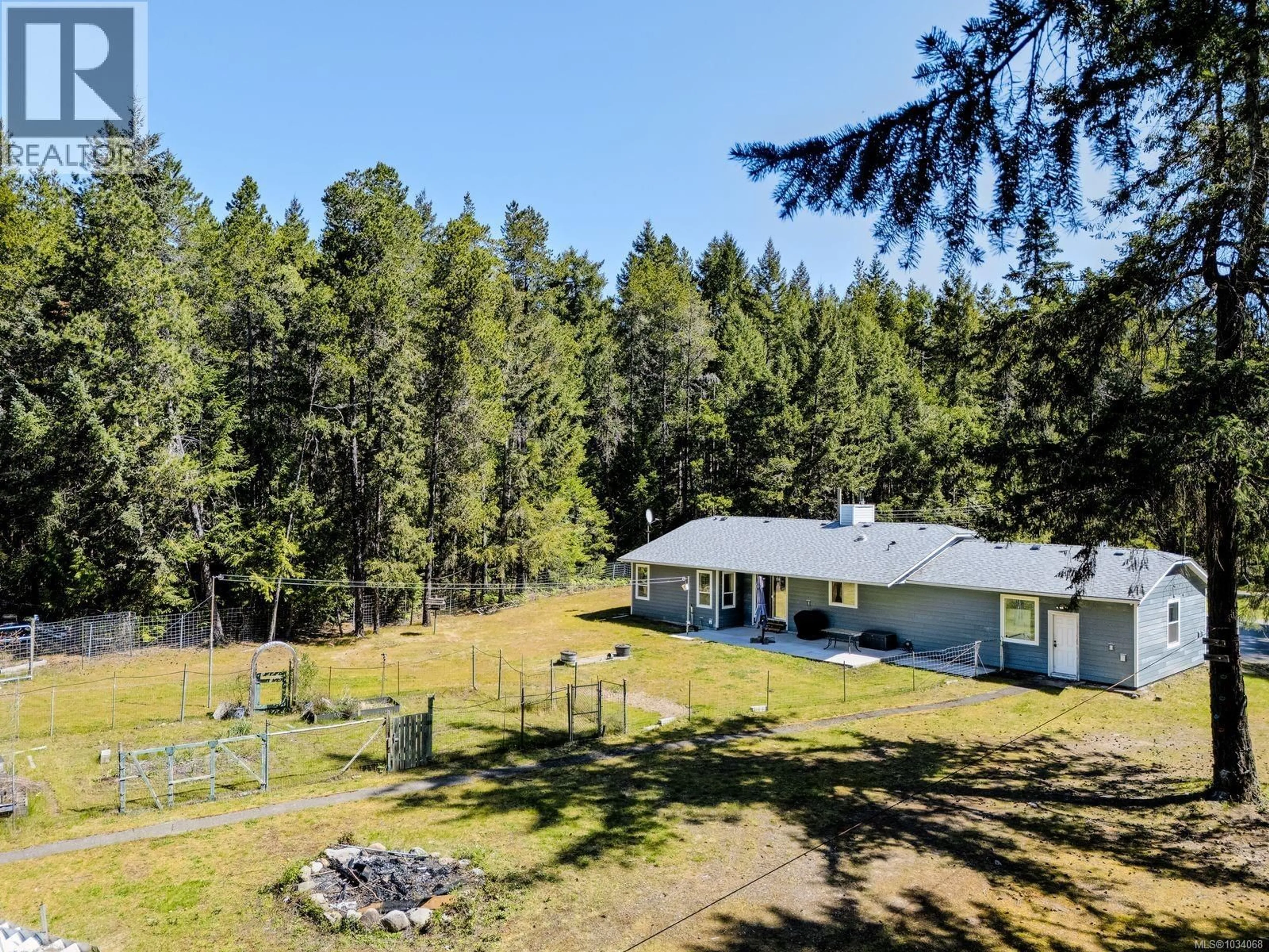 A pic from outside/outdoor area/front of a property/back of a property/a pic from drone, forest/trees view for 520 CORCAN ROAD, Qualicum Beach British Columbia V9K2E9