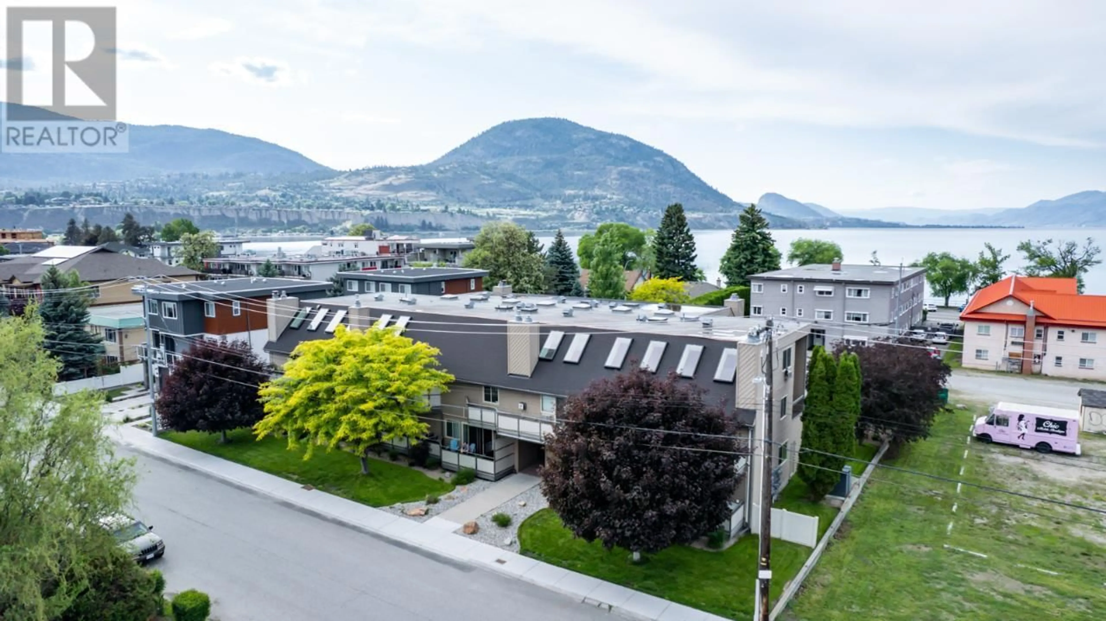 A pic from outside/outdoor area/front of a property/back of a property/a pic from drone, mountain view for 205 - 335 CHURCHILL AVENUE, Penticton British Columbia V2A1C9