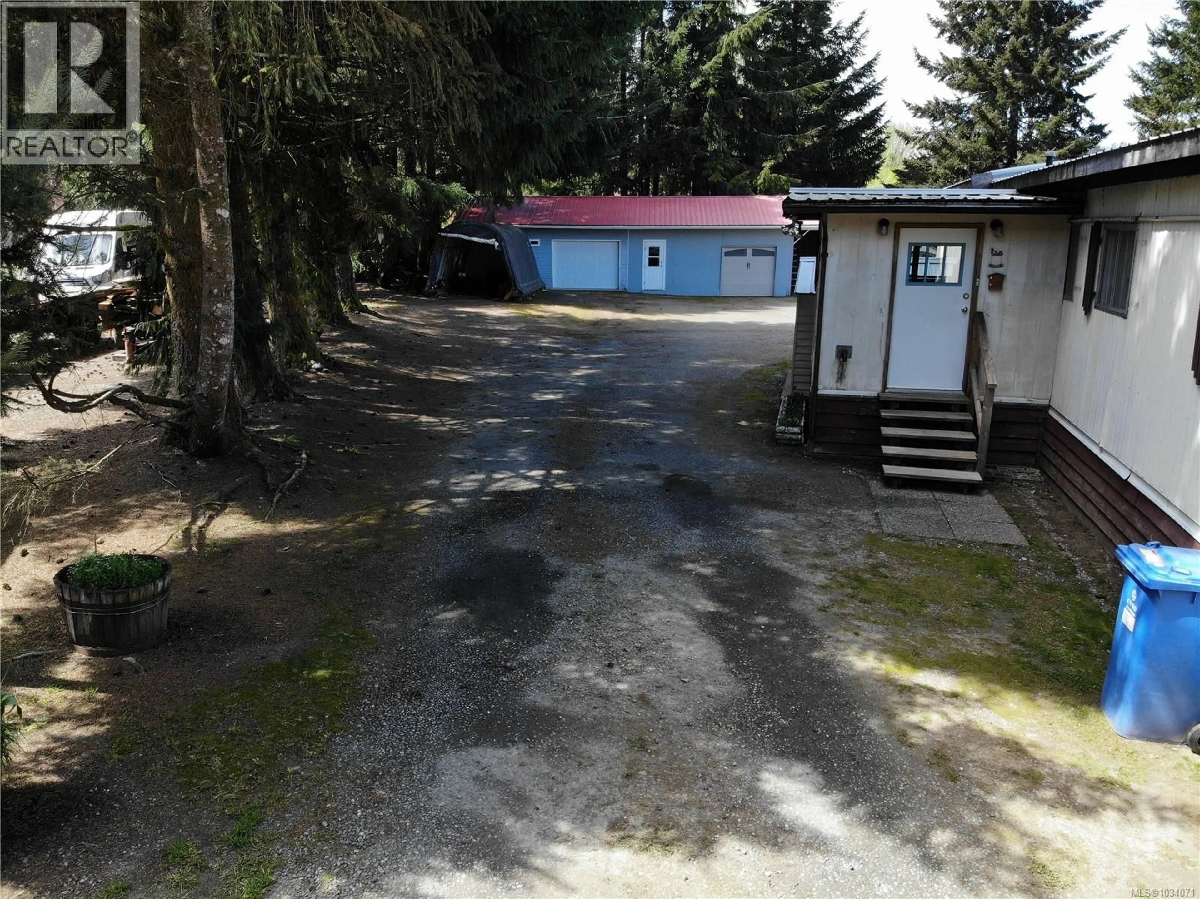 A pic from outside/outdoor area/front of a property/back of a property/a pic from drone, street for 6855 CHARLES PLACE, Honeymoon Bay British Columbia V0R1Y0