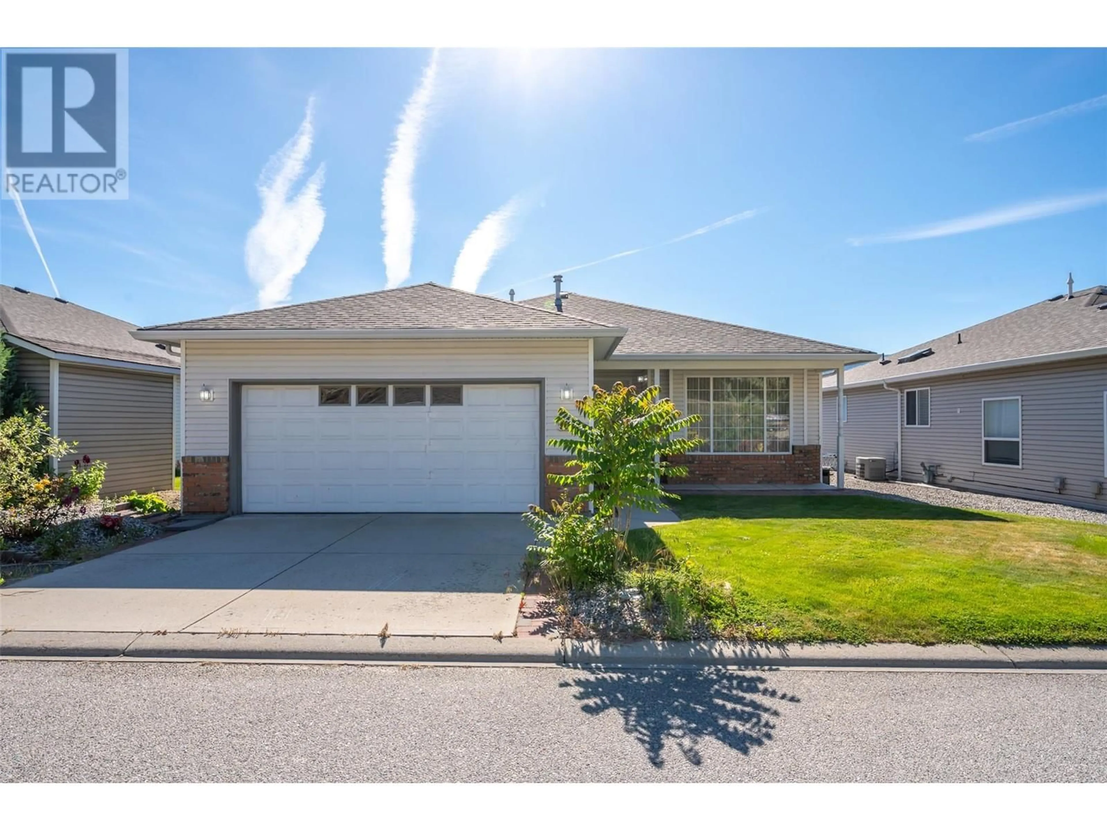 Home with vinyl exterior material, street for 506 RED WING DRIVE, Penticton British Columbia V2A8N7