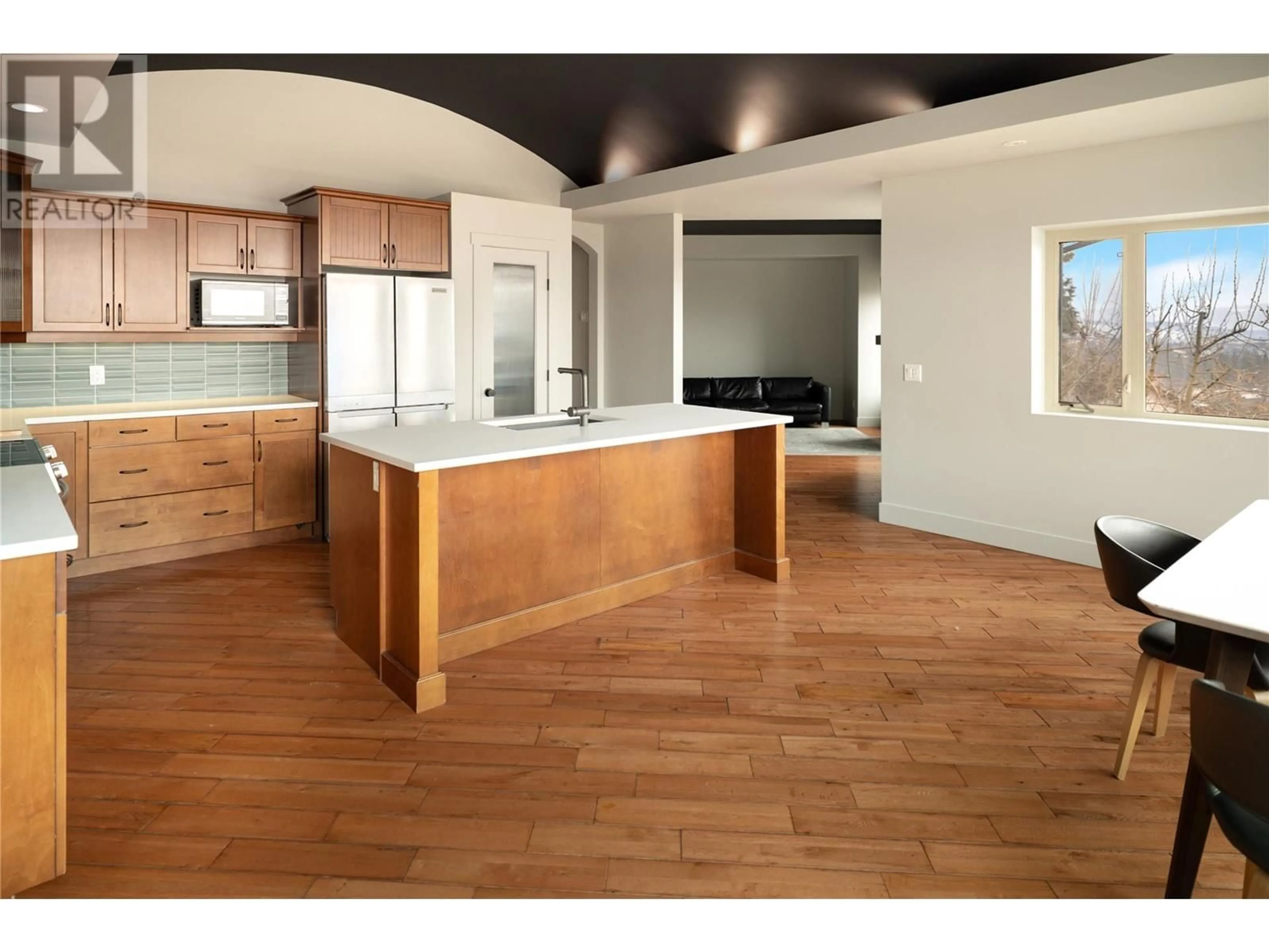 Open concept kitchen, wood/laminate floor for 3025 ENSIGN LANE, West Kelowna British Columbia V4T2Z4