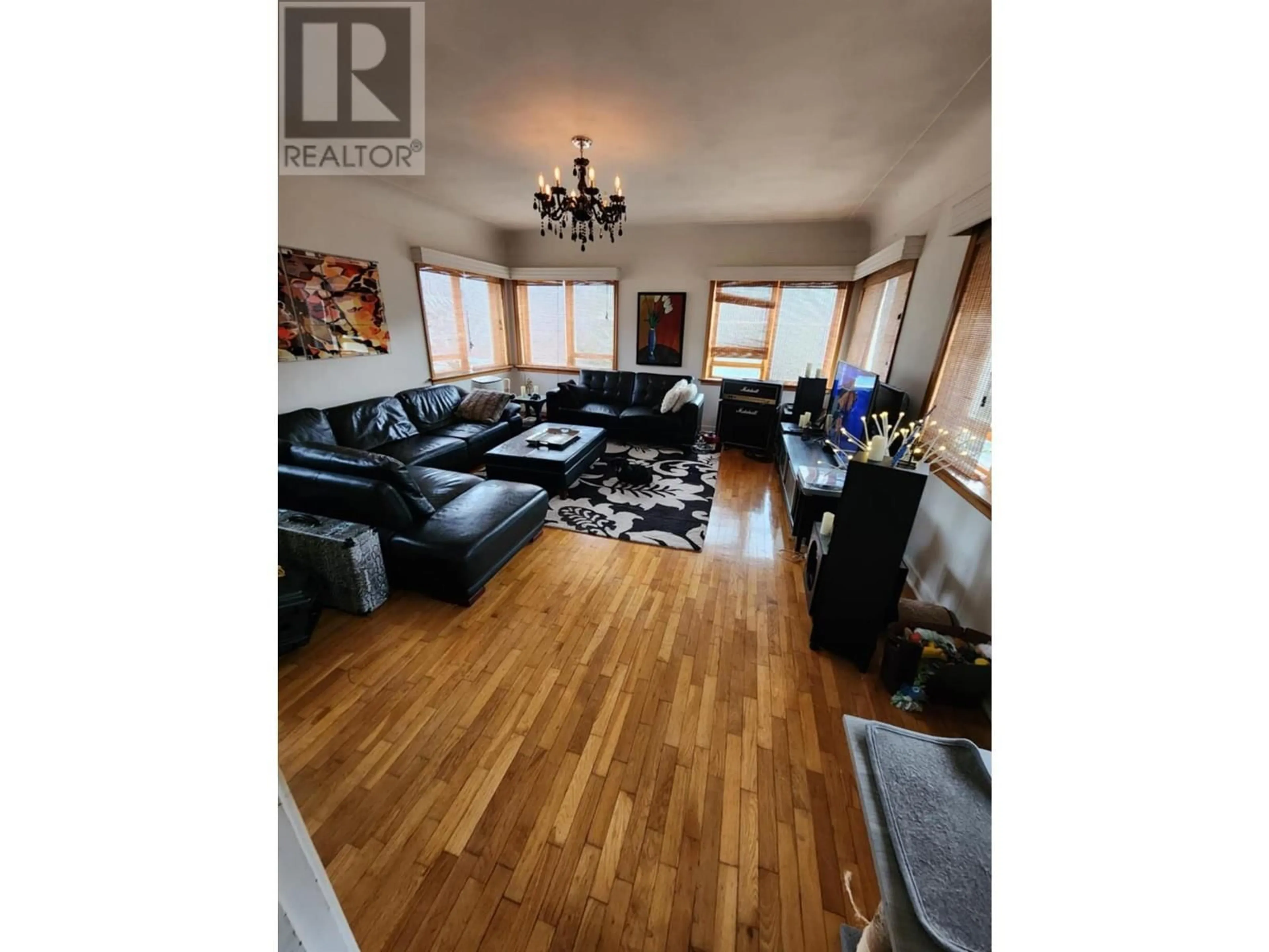Living room with furniture, wood/laminate floor for 3300 DAHLIA CRESCENT, Trail British Columbia V1R2X9