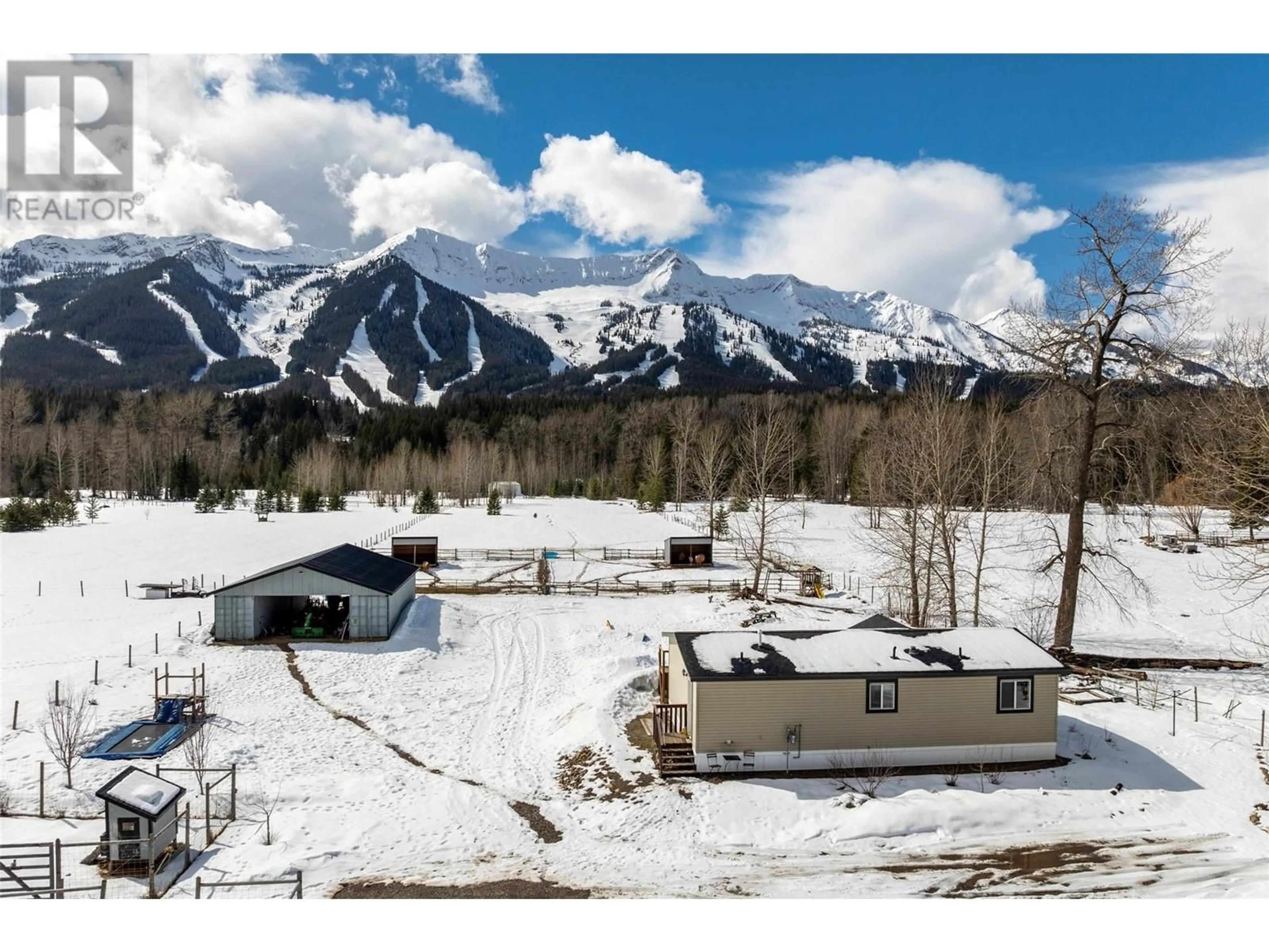 A pic from outside/outdoor area/front of a property/back of a property/a pic from drone, mountain view for 4103 HILL ROAD, Fernie British Columbia V0B1M4