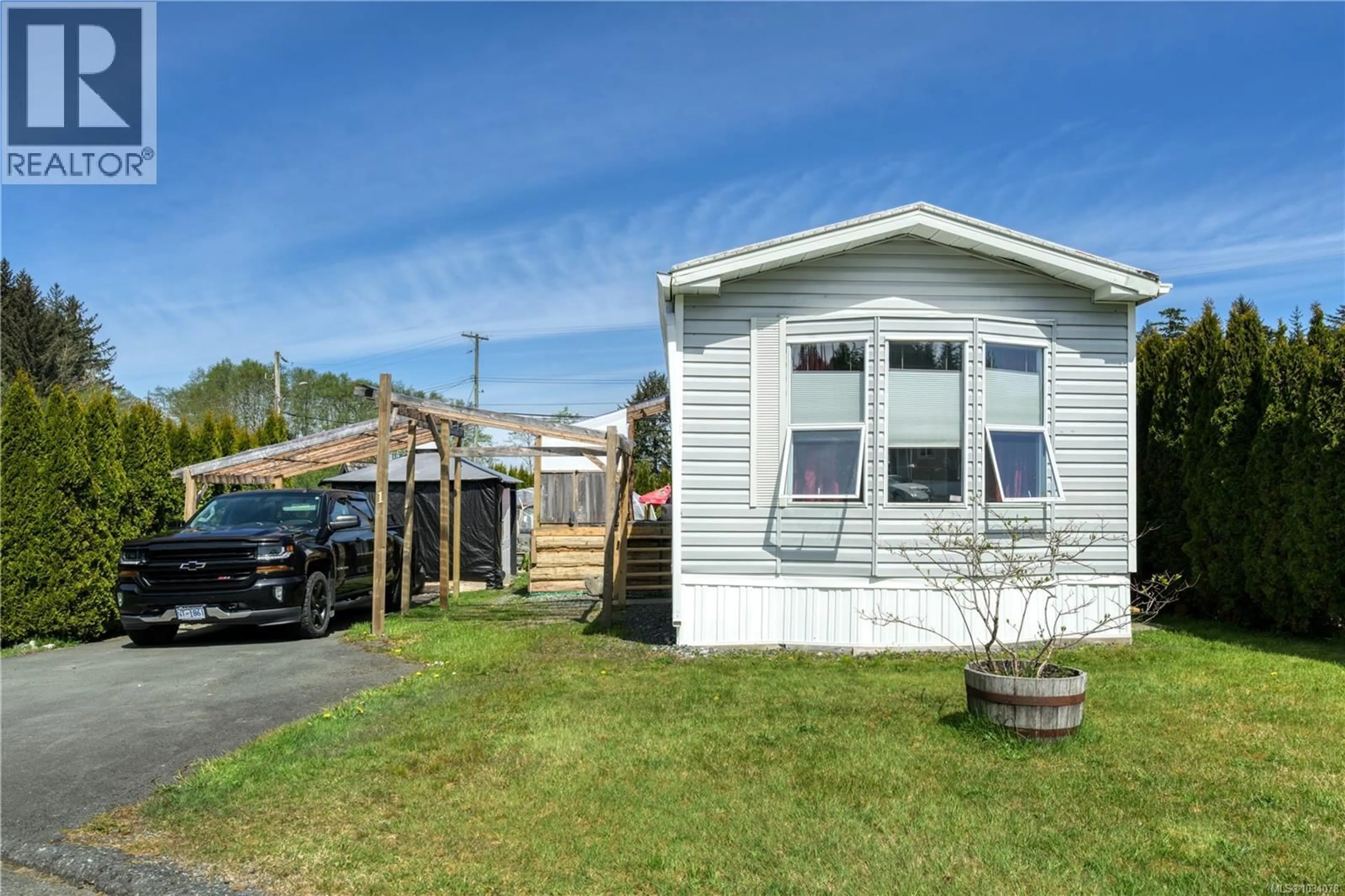 Home with vinyl exterior material, street for 1 - 5250 BEAVER HARBOUR ROAD, Port Hardy British Columbia V0N2P0