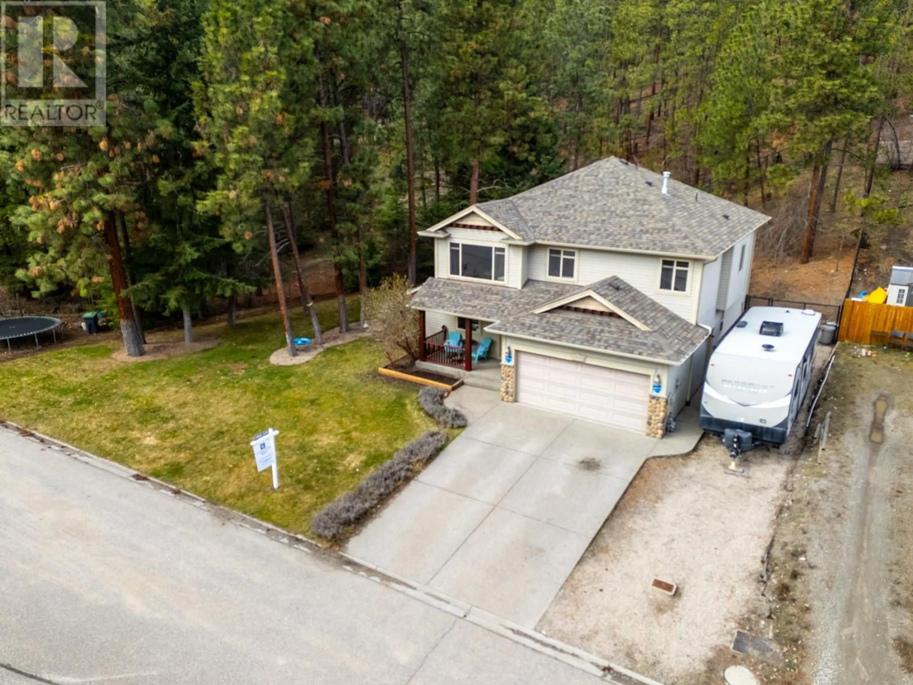 Home with vinyl exterior material, street for 1528 ROSEMEADOW DRIVE, West Kelowna British Columbia V1Z4A7