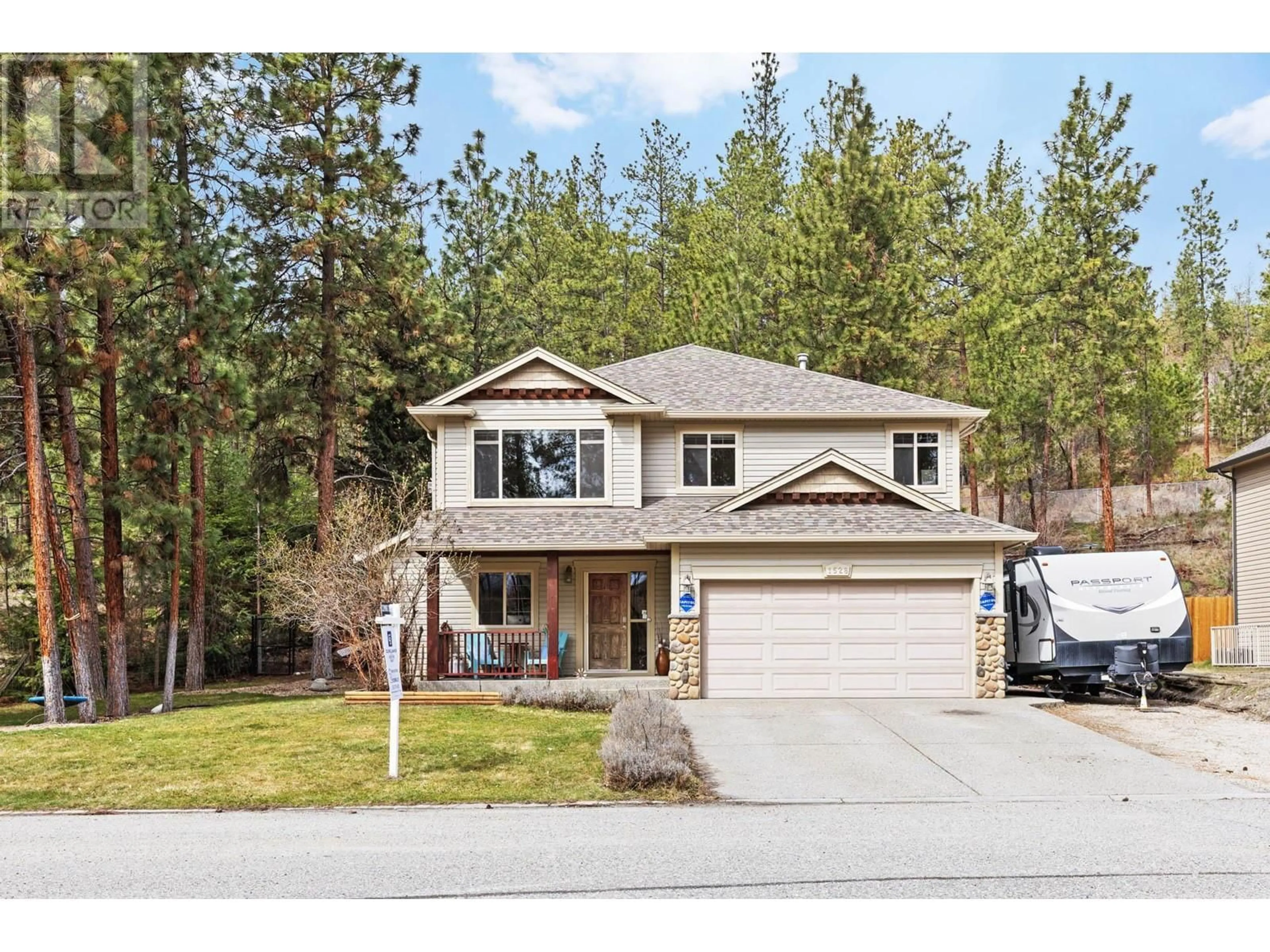 A pic from outside/outdoor area/front of a property/back of a property/a pic from drone, street for 1528 ROSEMEADOW DRIVE, West Kelowna British Columbia V1Z4A7