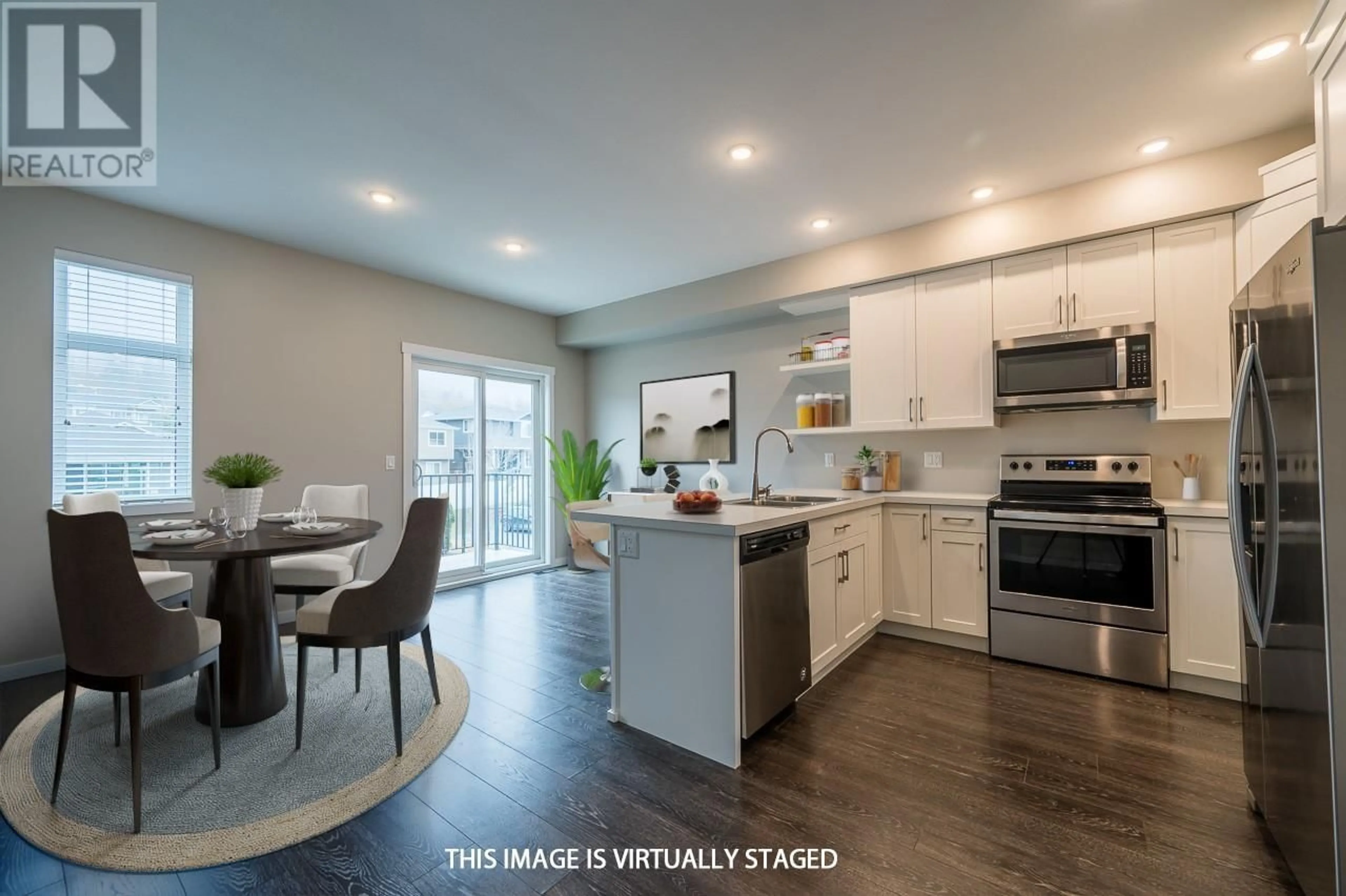 Open concept kitchen, wood/laminate floor for 101 - 1951 QU'APPELLE BOULEVARD, Kamloops British Columbia V2E0C8