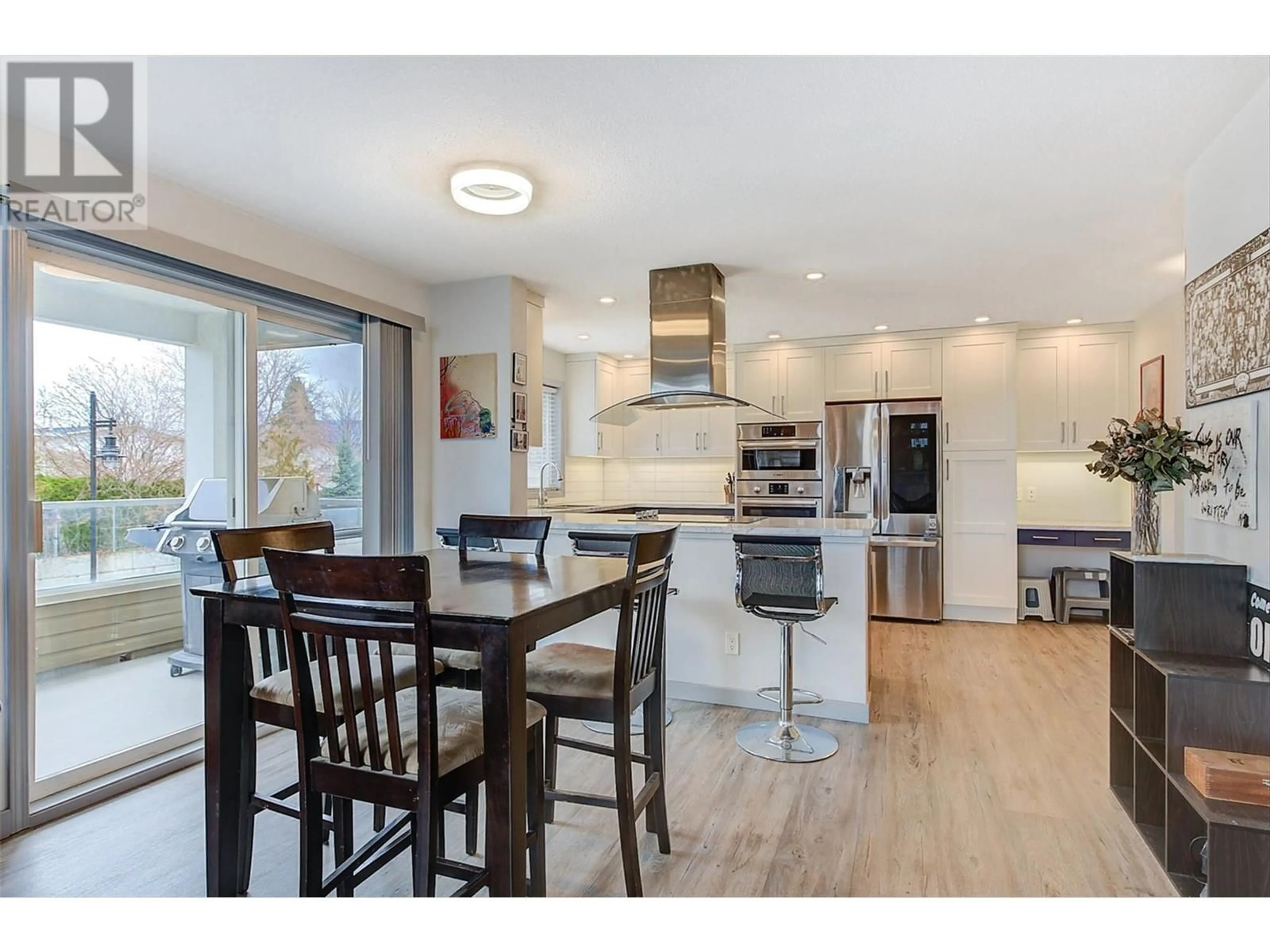 Open concept kitchen, wood/laminate floor for 205 - 555 HOUGHTON ROAD, Kelowna British Columbia V1X7P9