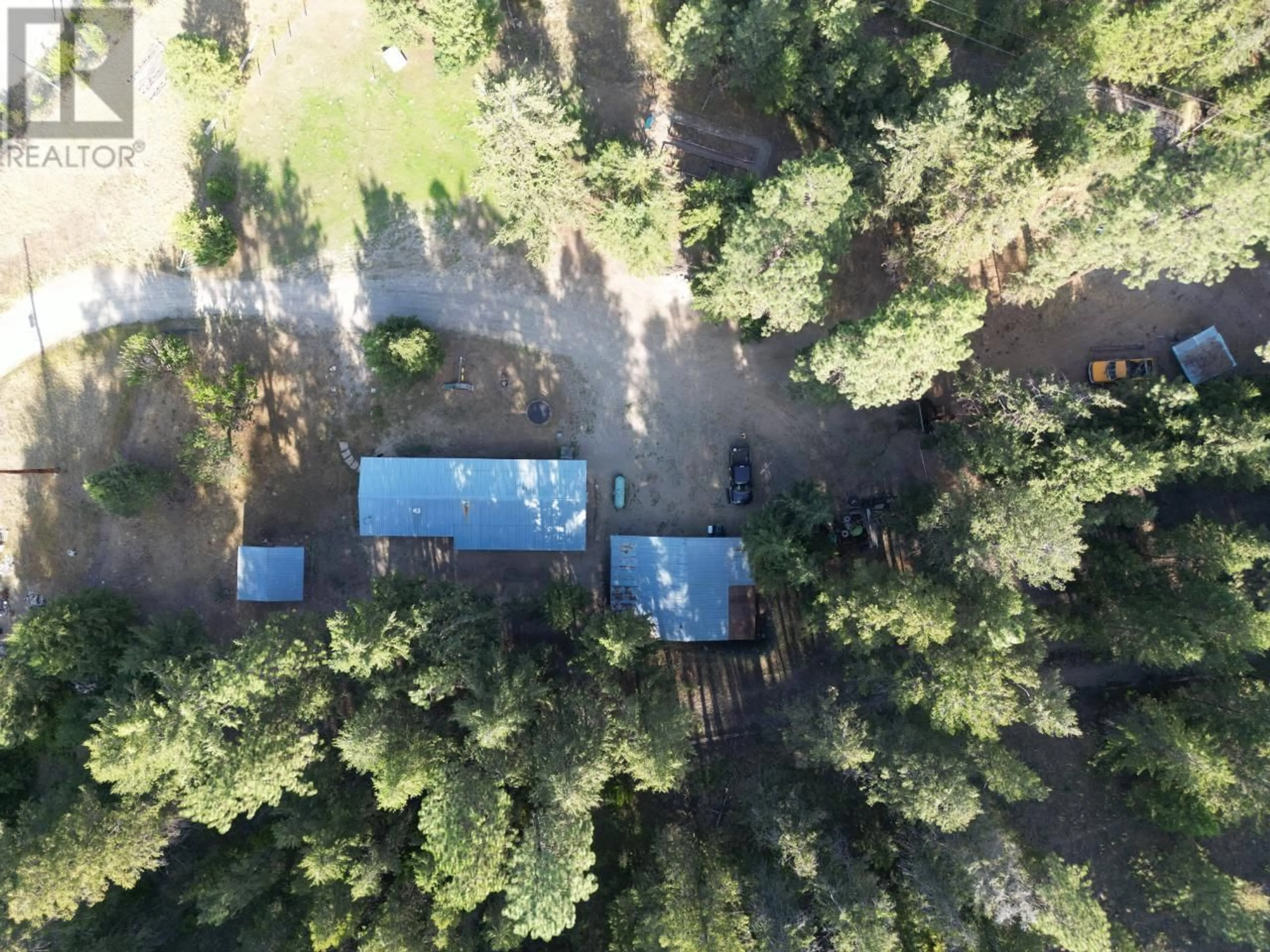 A pic from outside/outdoor area/front of a property/back of a property/a pic from drone, forest/trees view for 4160 HIGHWAY 3 HIGHWAY, Rock Creek British Columbia V0H1Y0