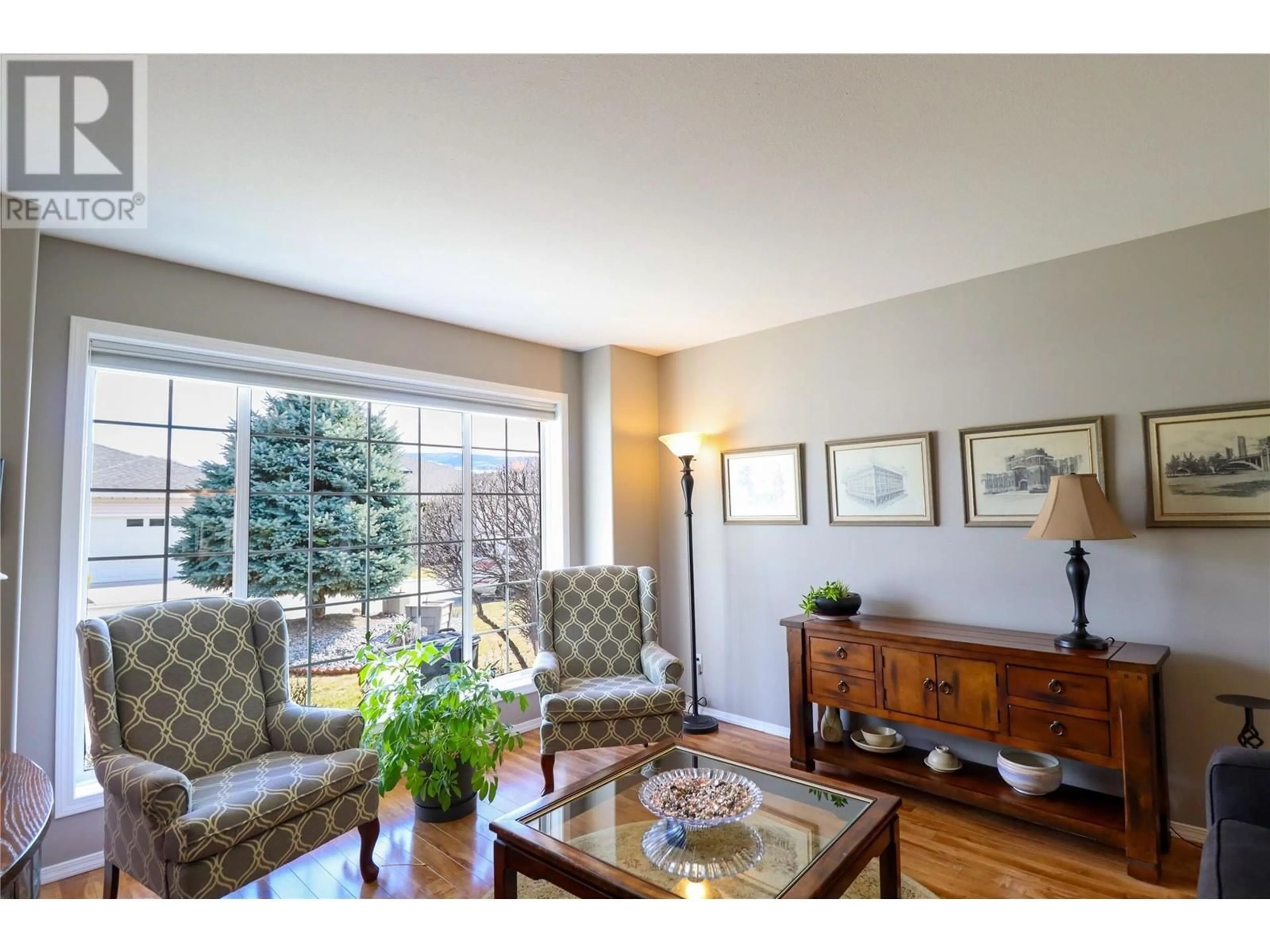 Living room with furniture, wood/laminate floor for 531 RED WING DRIVE, Penticton British Columbia V2A7K8