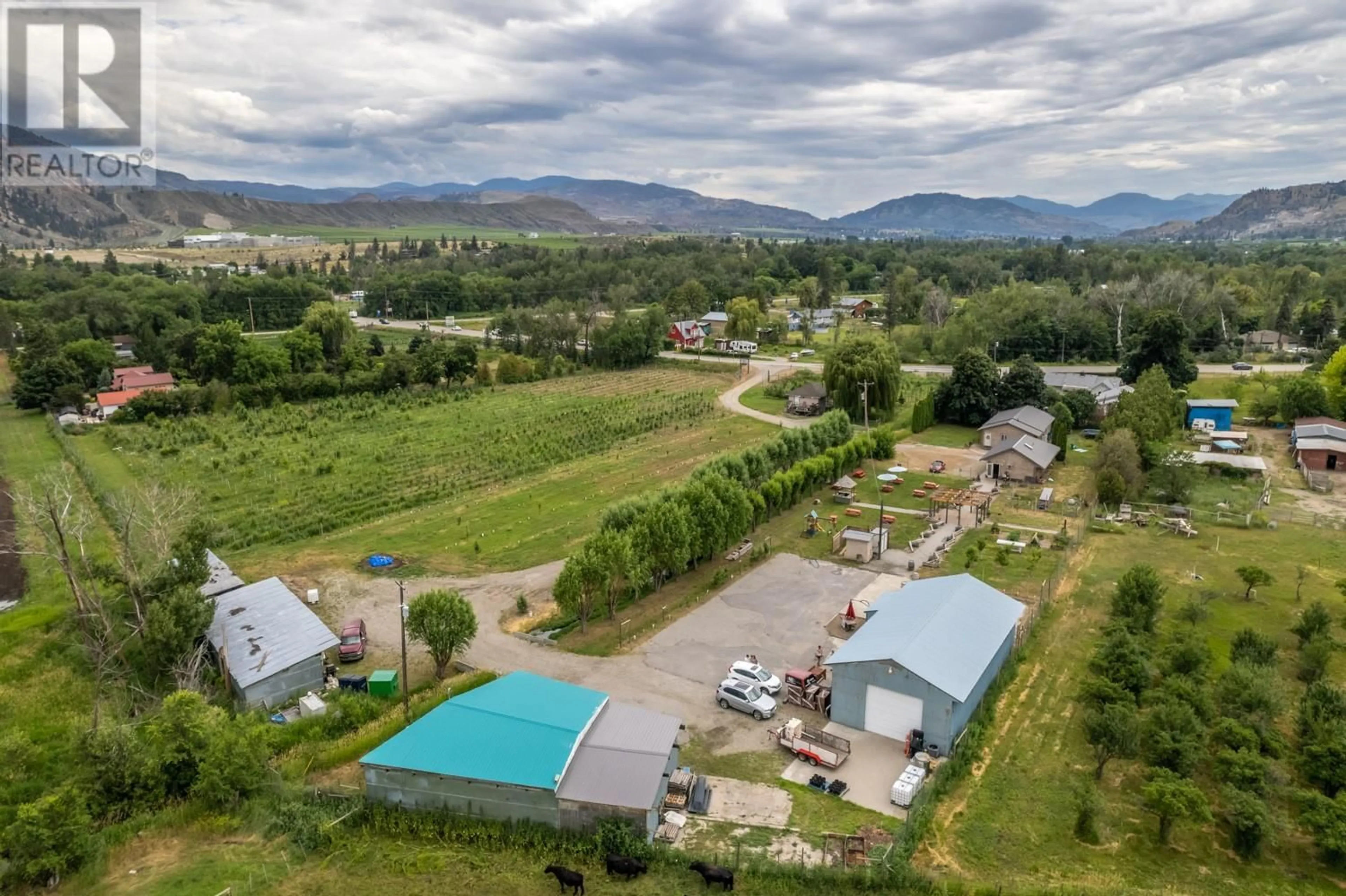 A pic from outside/outdoor area/front of a property/back of a property/a pic from drone, mountain view for 7952 97 HIGHWAY, Oliver British Columbia V0H1T0
