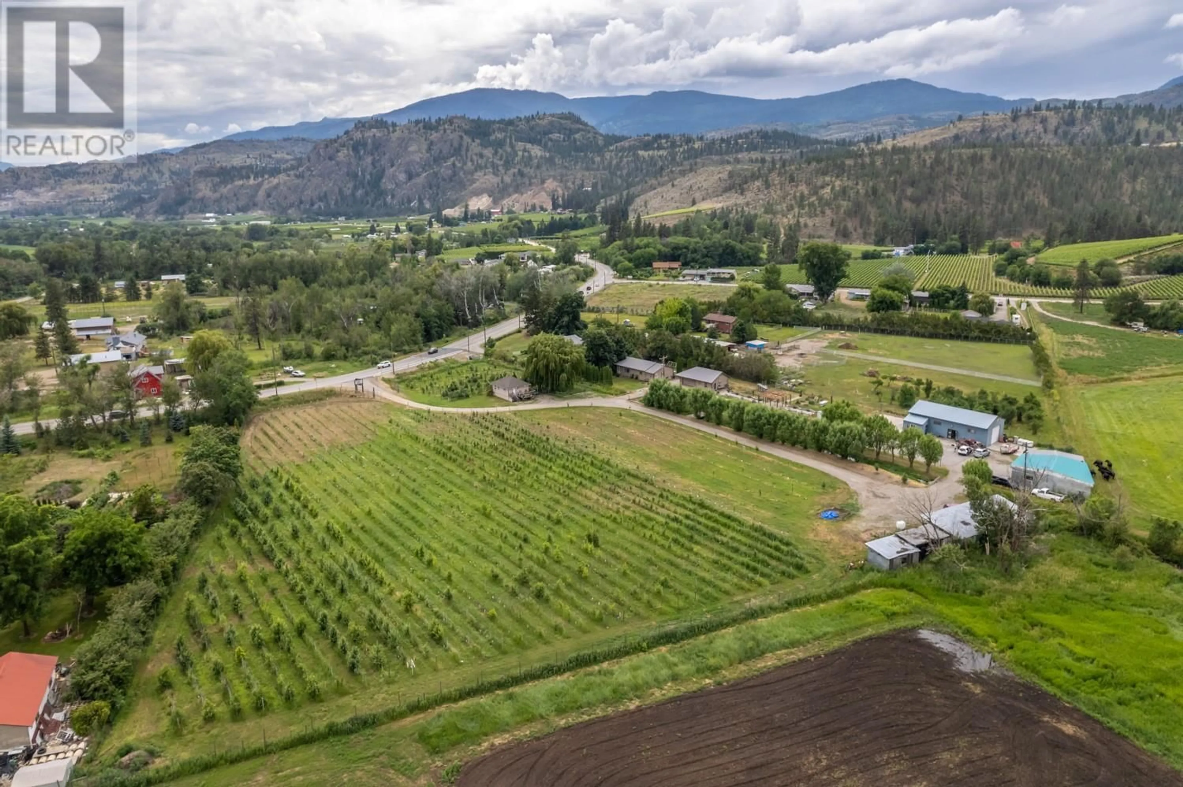 A pic from outside/outdoor area/front of a property/back of a property/a pic from drone, mountain view for 7952 97 HIGHWAY, Oliver British Columbia V0H1T0