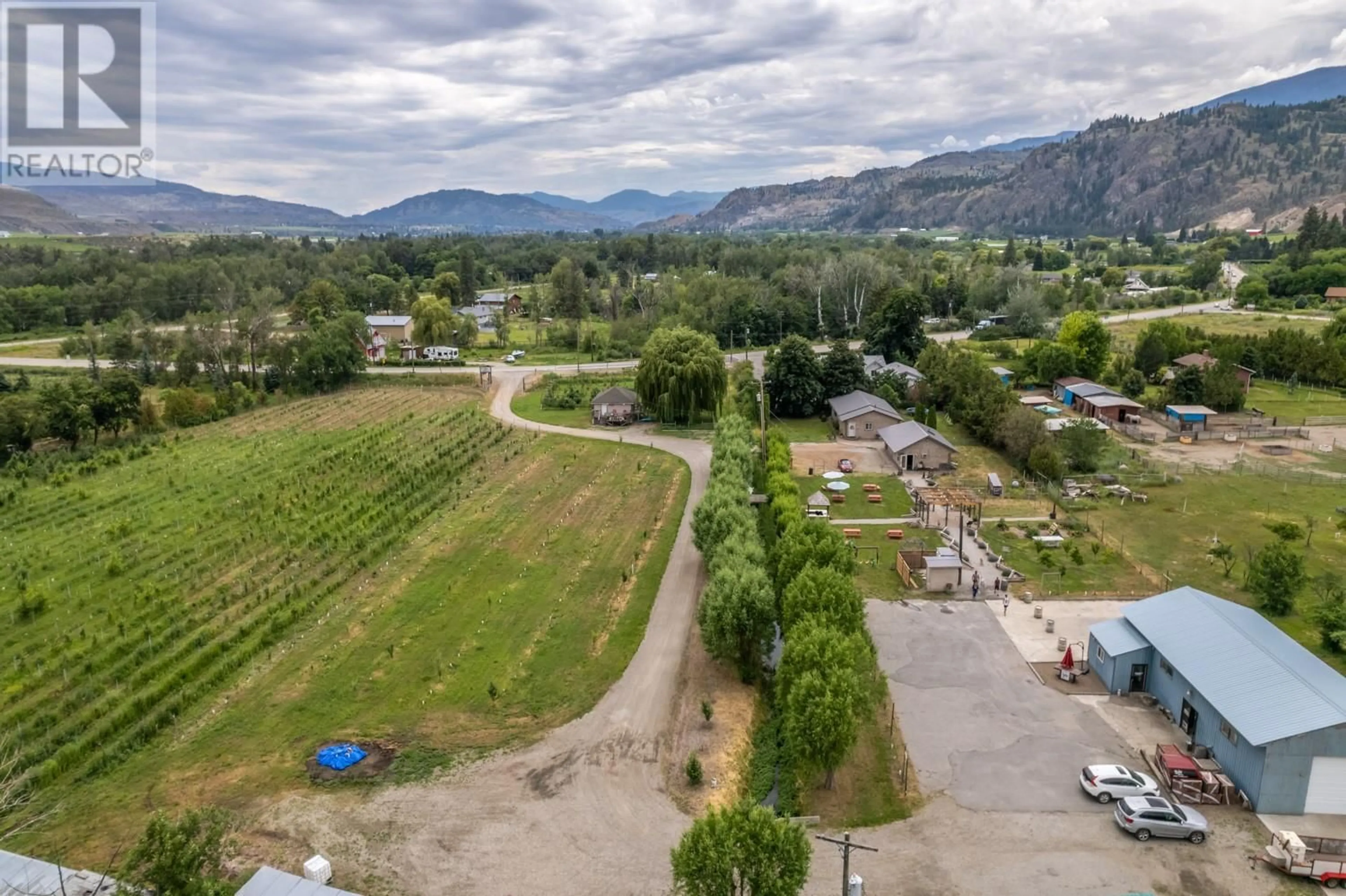 A pic from outside/outdoor area/front of a property/back of a property/a pic from drone, mountain view for 7952 97 HIGHWAY, Oliver British Columbia V0H1T0