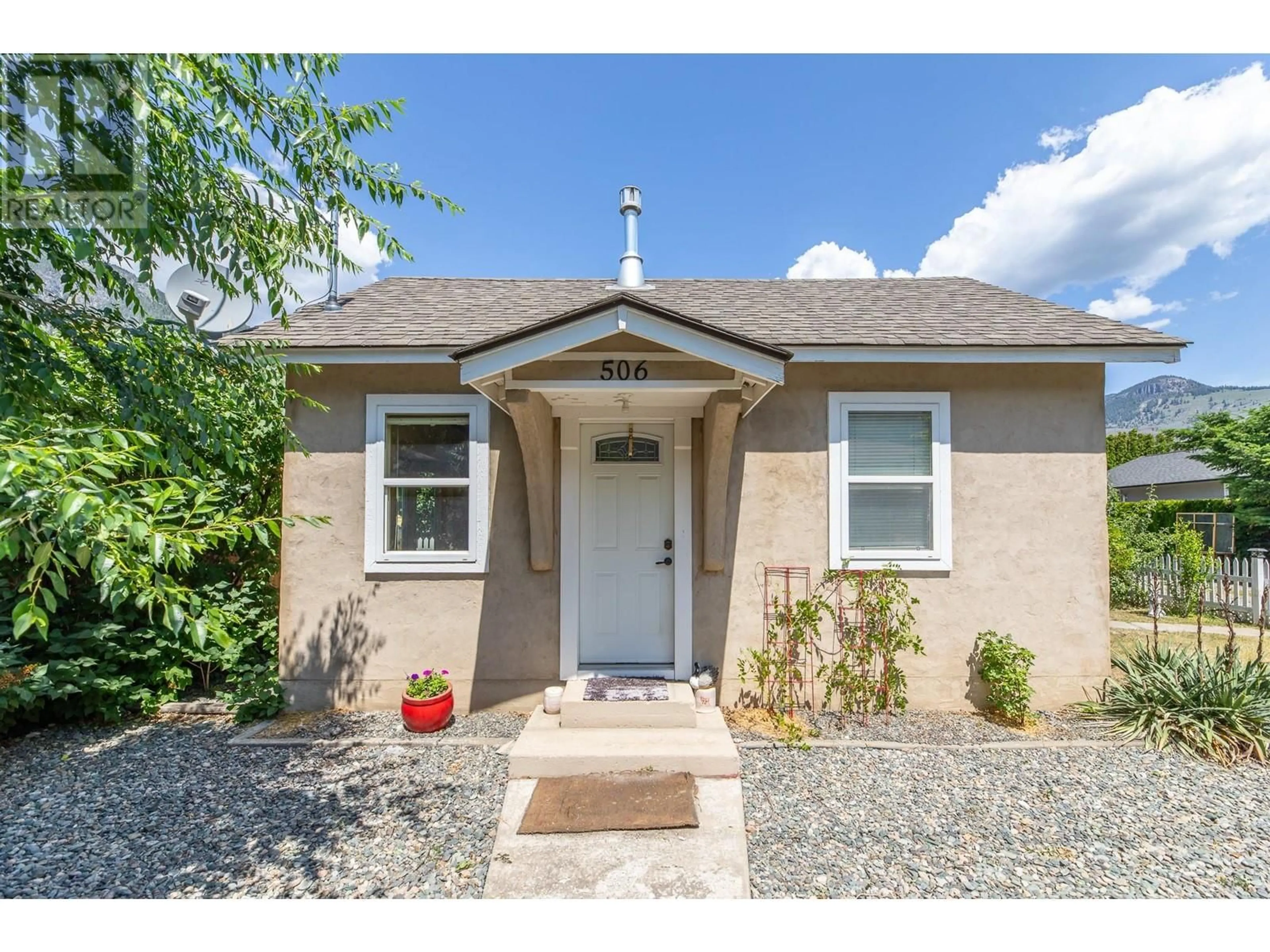 Home with vinyl exterior material, street for 506 10TH AVENUE, Keremeos British Columbia V0X1N3