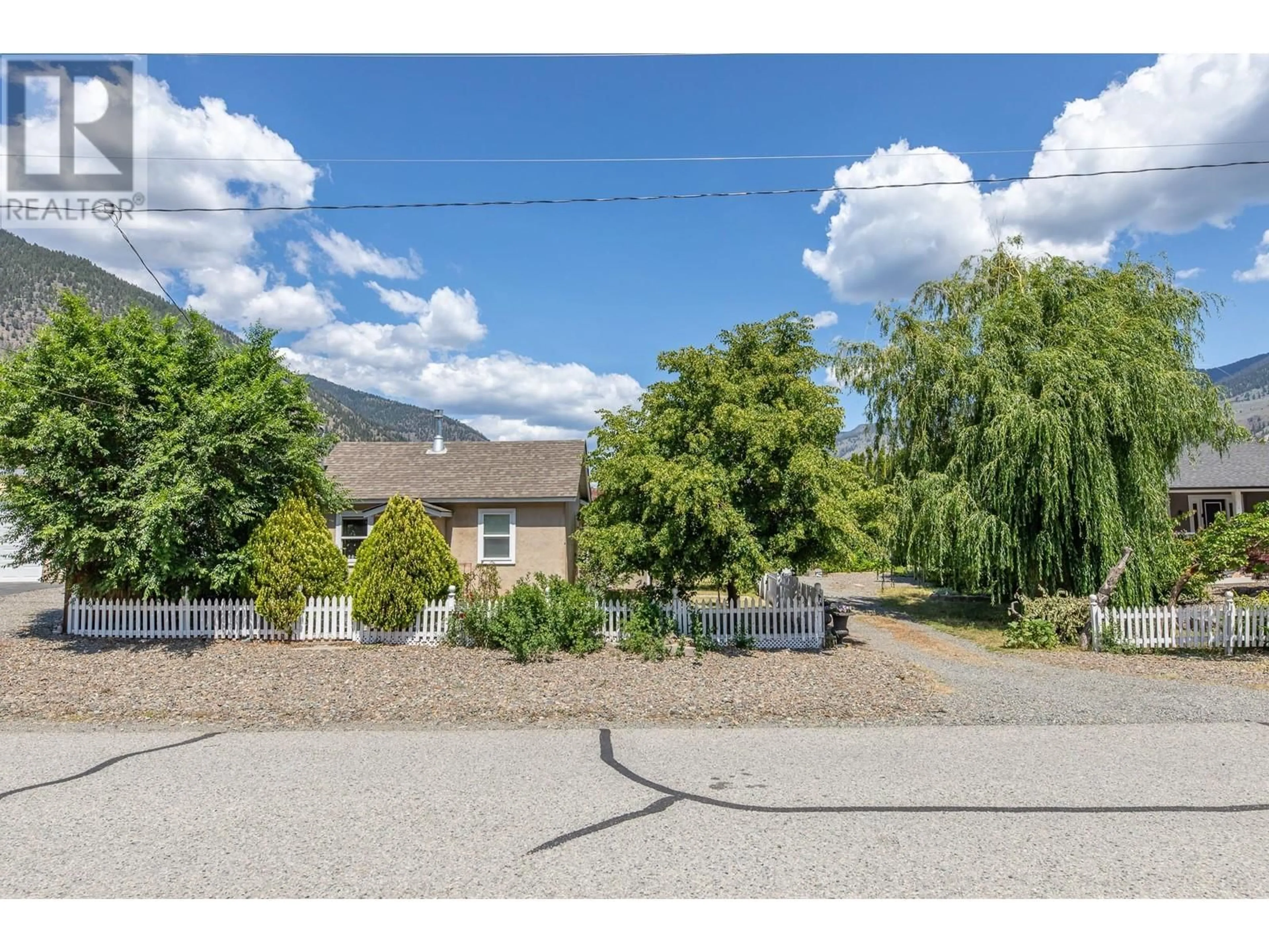 A pic from outside/outdoor area/front of a property/back of a property/a pic from drone, mountain view for 506 10TH AVENUE, Keremeos British Columbia V0X1N3