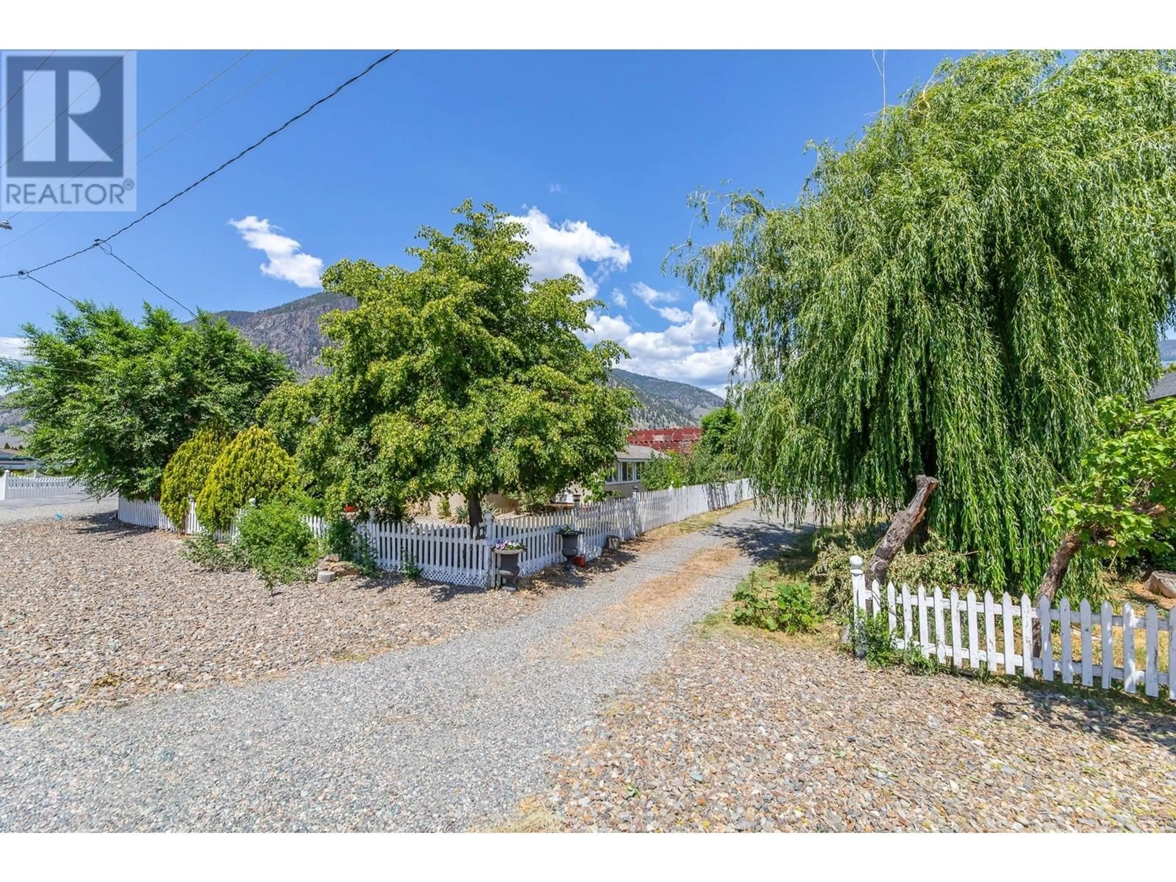 A pic from outside/outdoor area/front of a property/back of a property/a pic from drone, mountain view for 506 10TH AVENUE, Keremeos British Columbia V0X1N3