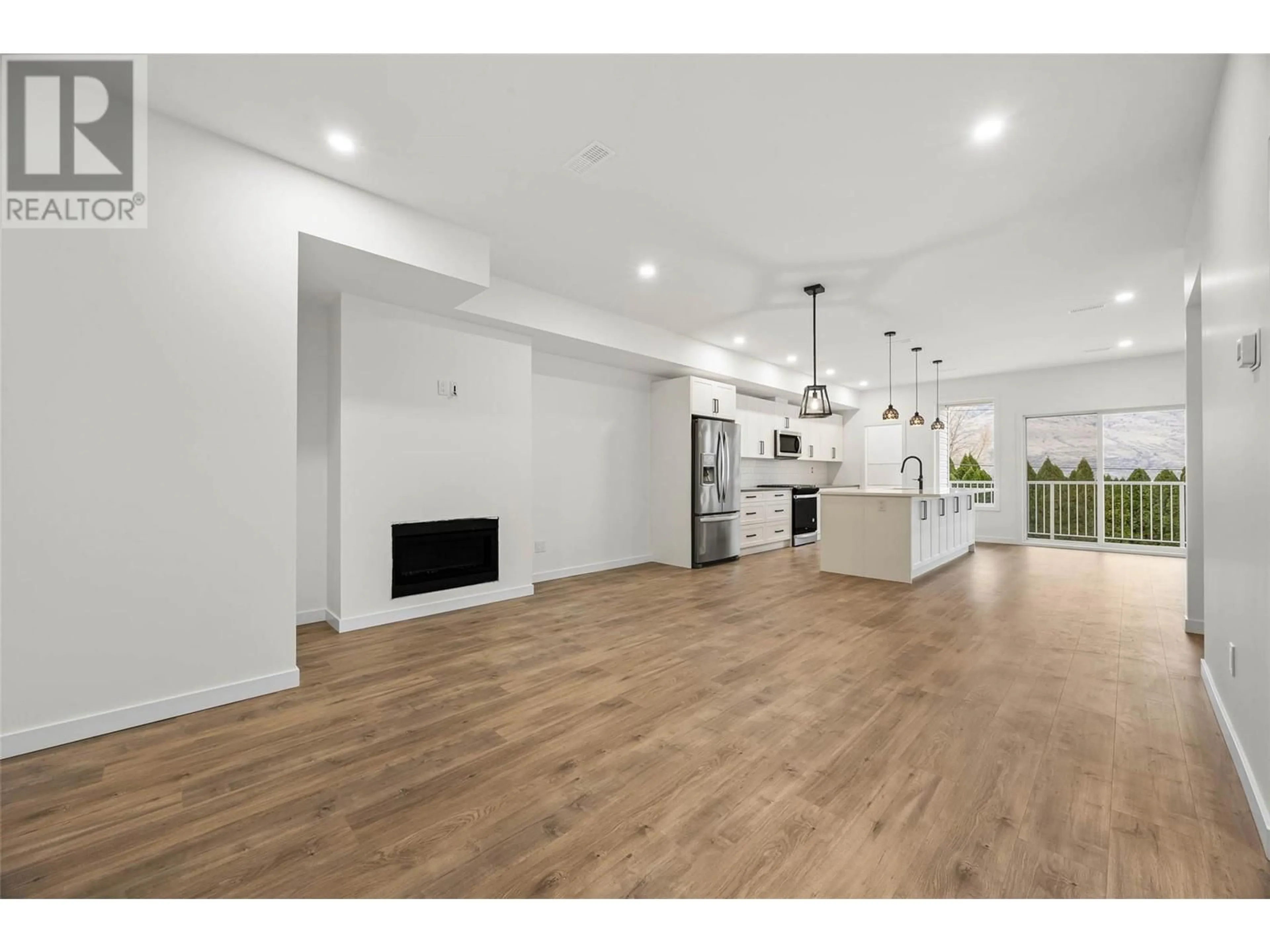 Open concept kitchen, wood/laminate floor for 6511 SAVONA ACCESS ROAD, Kamloops British Columbia V2H1T7