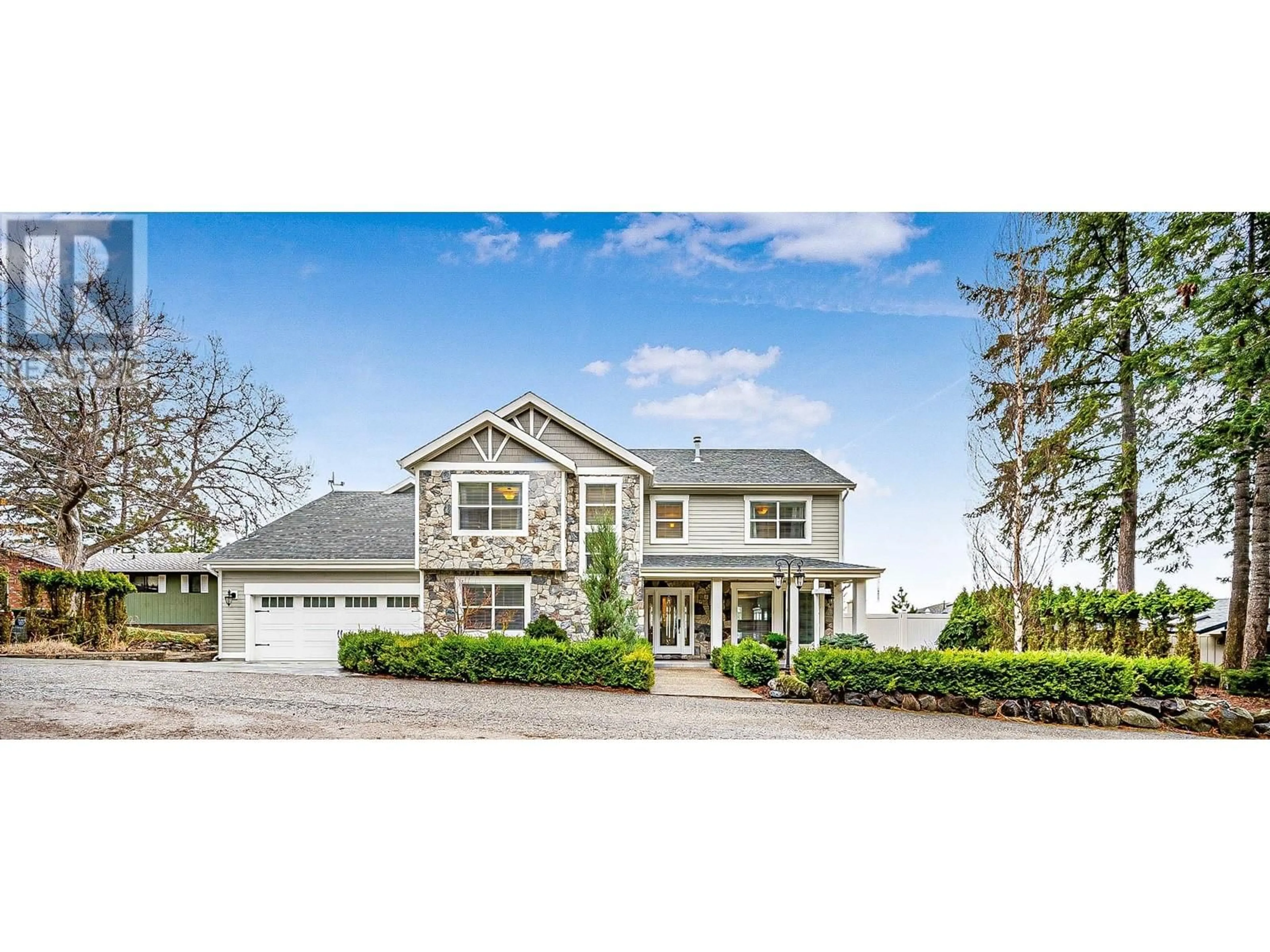 Home with vinyl exterior material, street for 1202 TREVOR DRIVE, West Kelowna British Columbia V1Z3K7