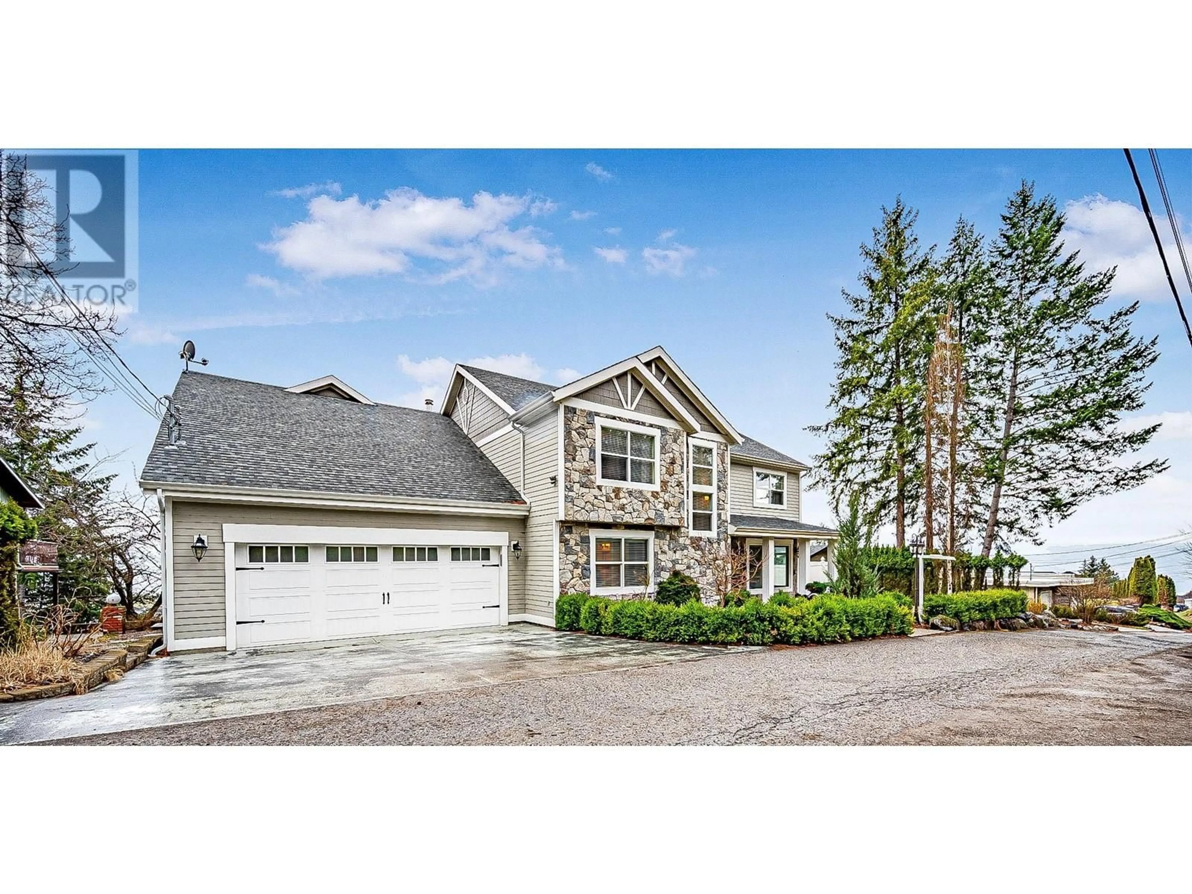 Home with vinyl exterior material, street for 1202 TREVOR DRIVE, West Kelowna British Columbia V1Z3K7