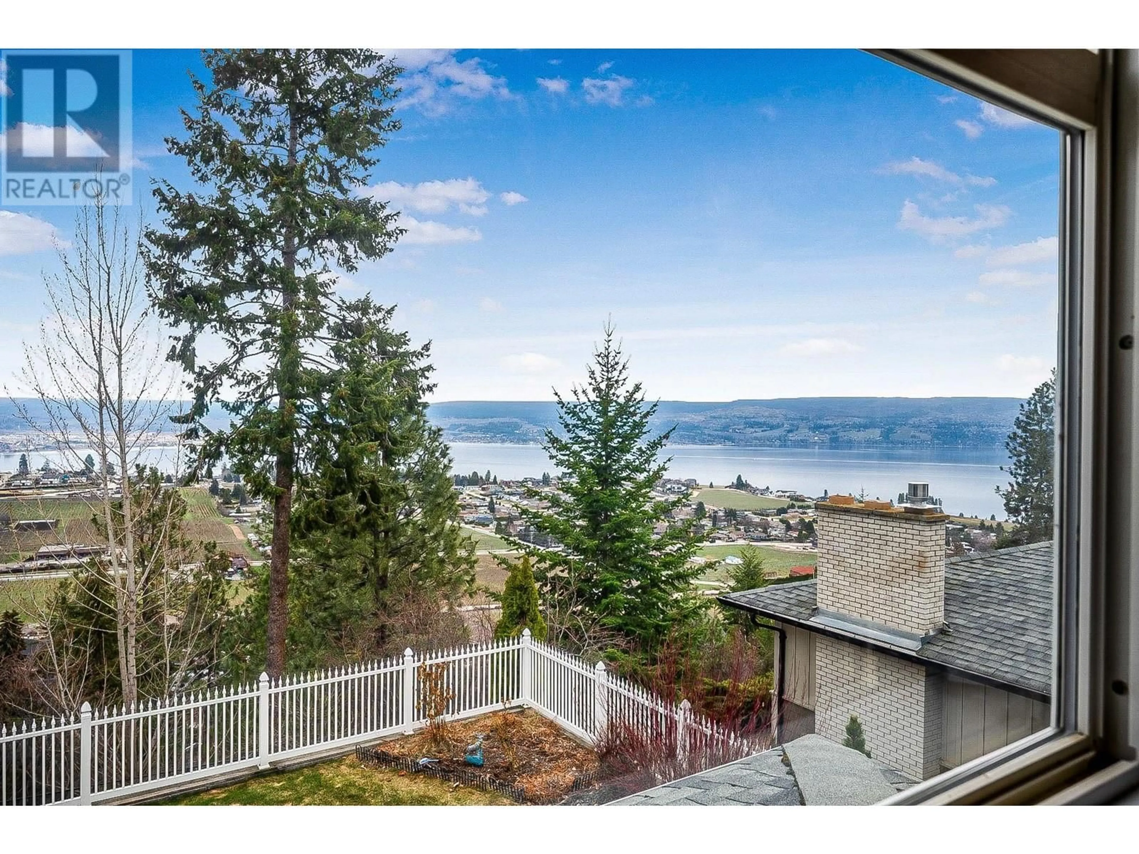 A pic from outside/outdoor area/front of a property/back of a property/a pic from drone, water/lake/river/ocean view for 1202 TREVOR DRIVE, West Kelowna British Columbia V1Z3K7