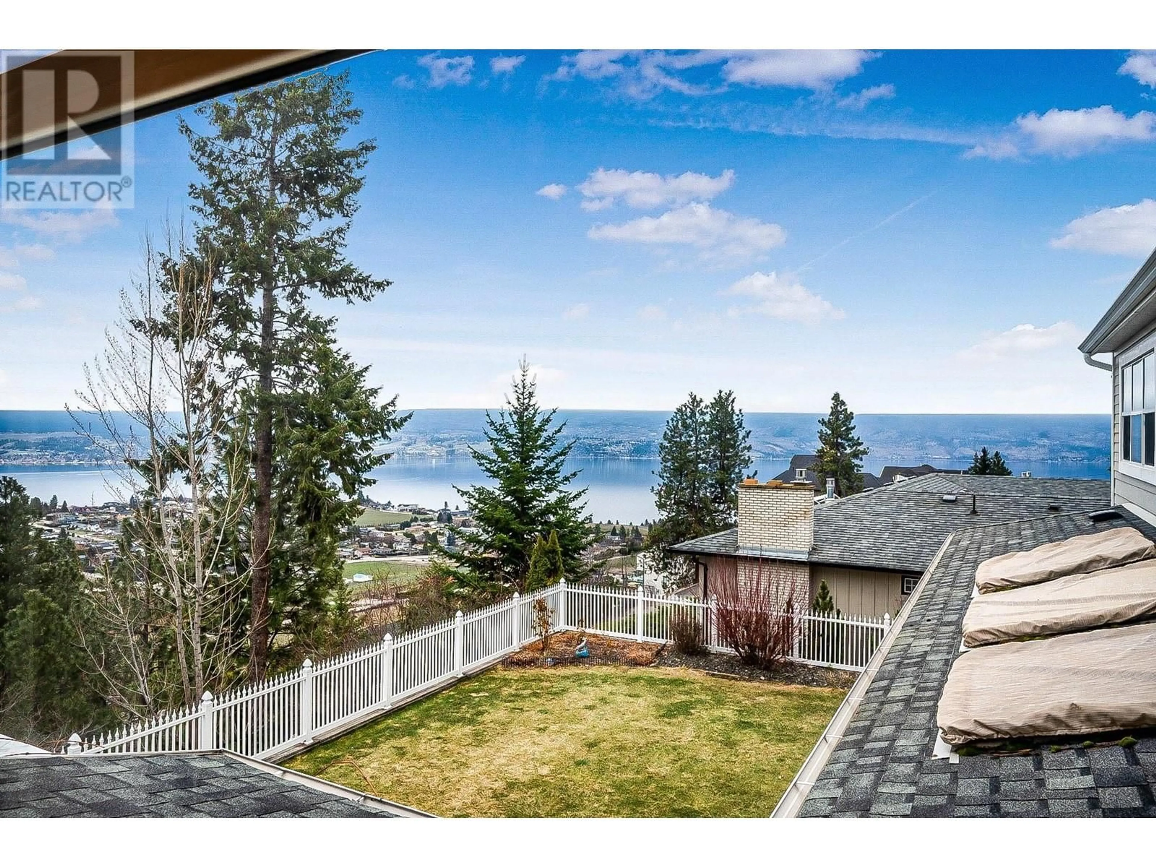 A pic from outside/outdoor area/front of a property/back of a property/a pic from drone, water/lake/river/ocean view for 1202 TREVOR DRIVE, West Kelowna British Columbia V1Z3K7