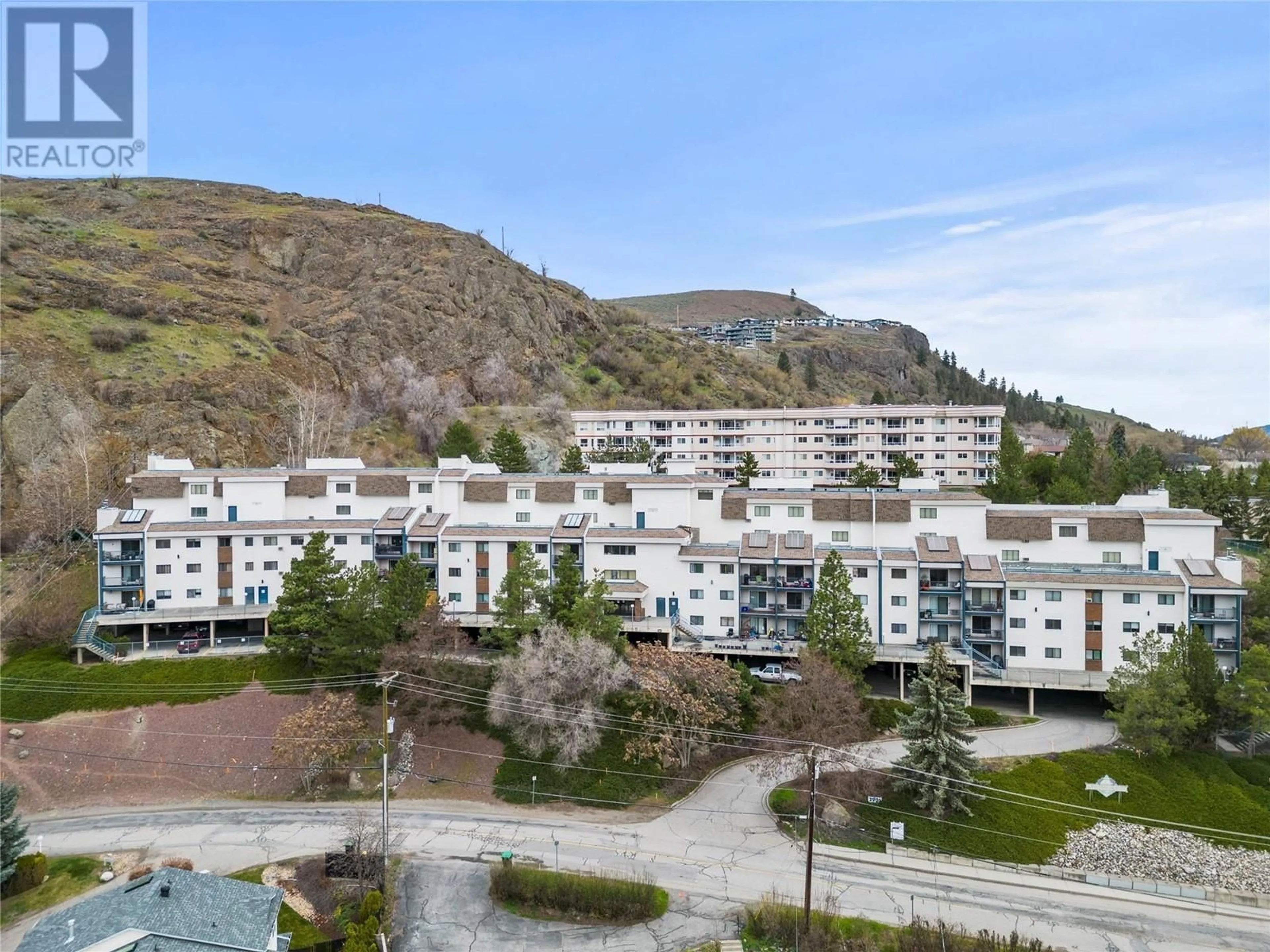A pic from outside/outdoor area/front of a property/back of a property/a pic from drone, mountain view for 210 - 3901 32 AVENUE, Vernon British Columbia V1T8M3