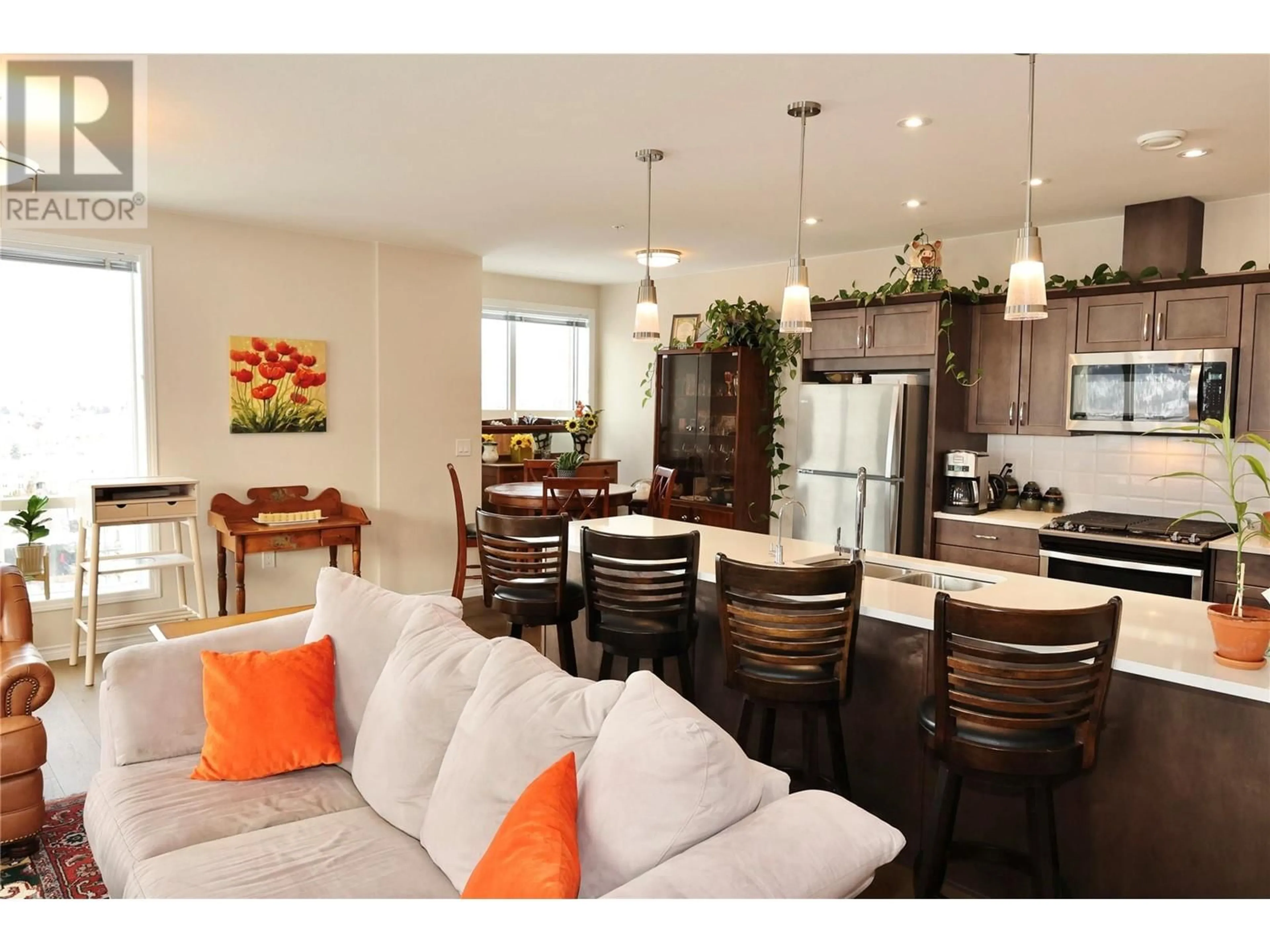 Open concept kitchen, wood/laminate floor for 1202 - 3346 SKAHA LAKE ROAD, Penticton British Columbia V2A6G4