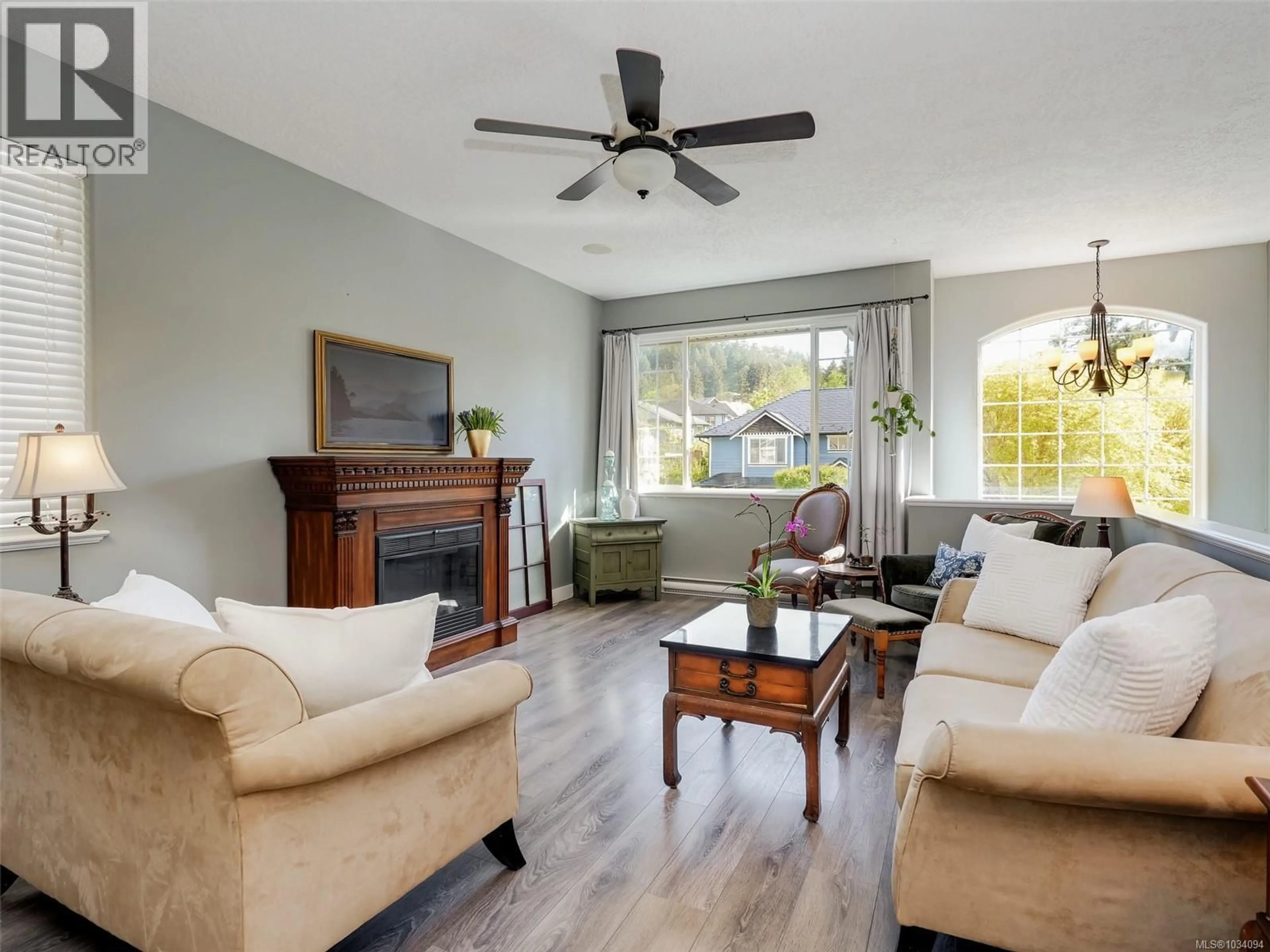 Living room with furniture, wood/laminate floor for 974 WILD RIDGE WAY, Langford British Columbia V9C4M8