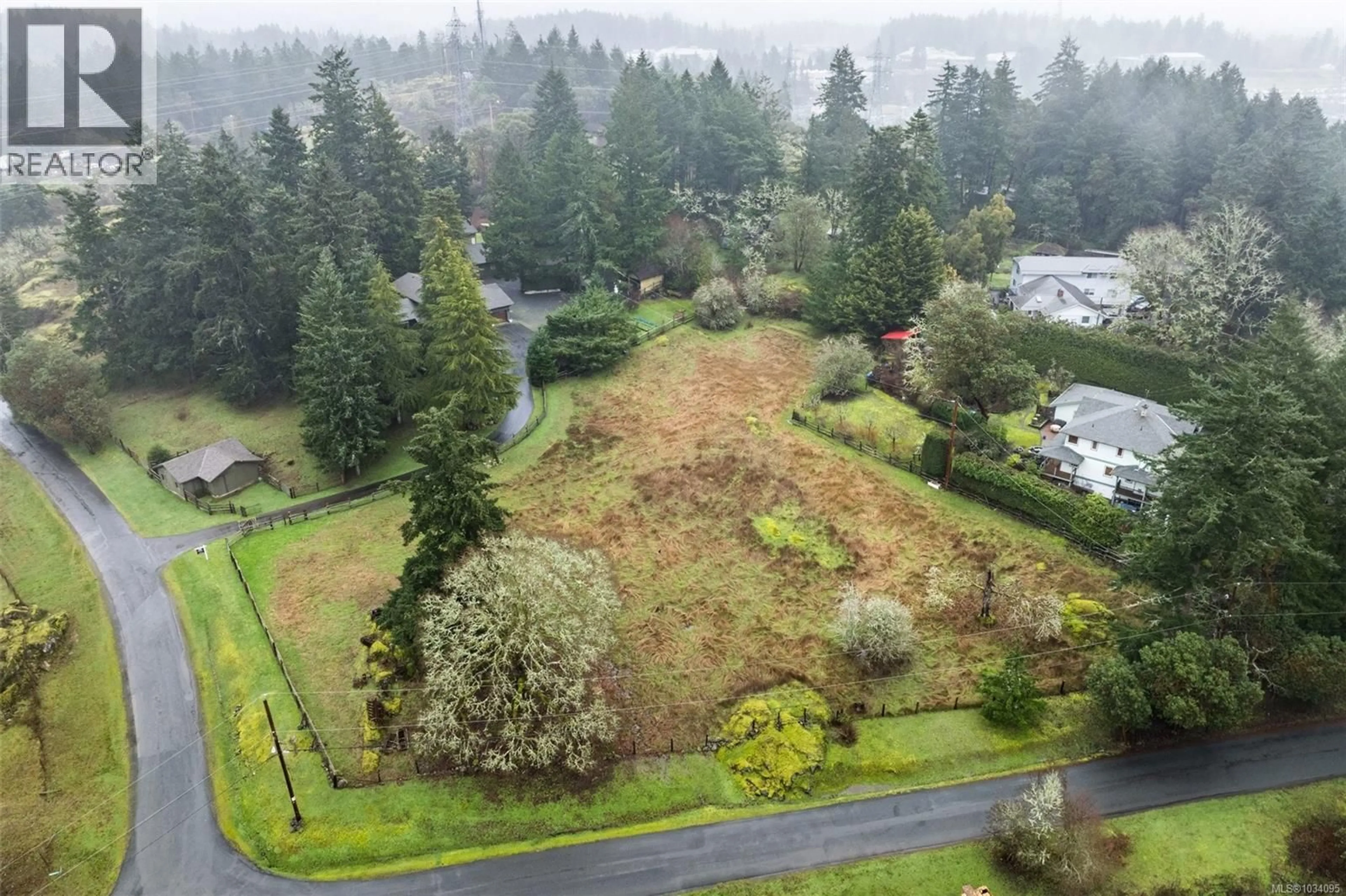 A pic from outside/outdoor area/front of a property/back of a property/a pic from drone, forest/trees view for 4395 LIBERTO ROAD, Saanich British Columbia V9E2C4