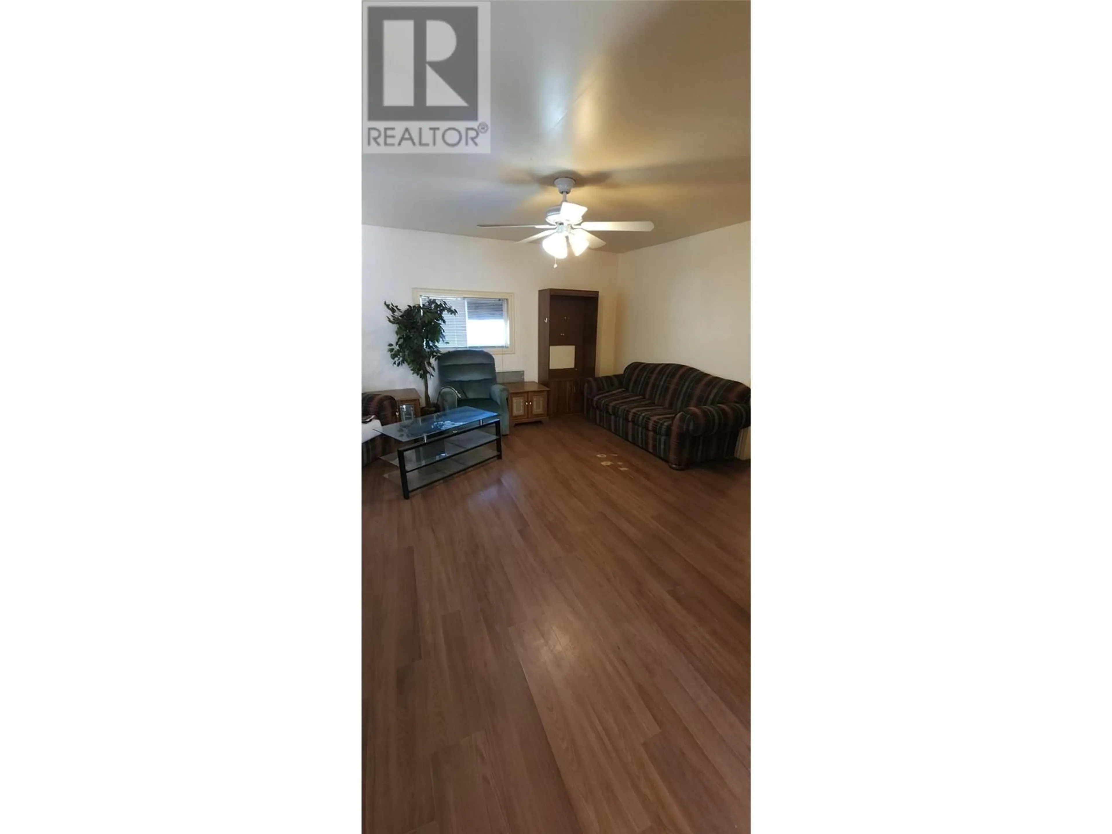 Living room with furniture, wood/laminate floor for 110 BARNES STREET, Ashcroft British Columbia V0K2P0