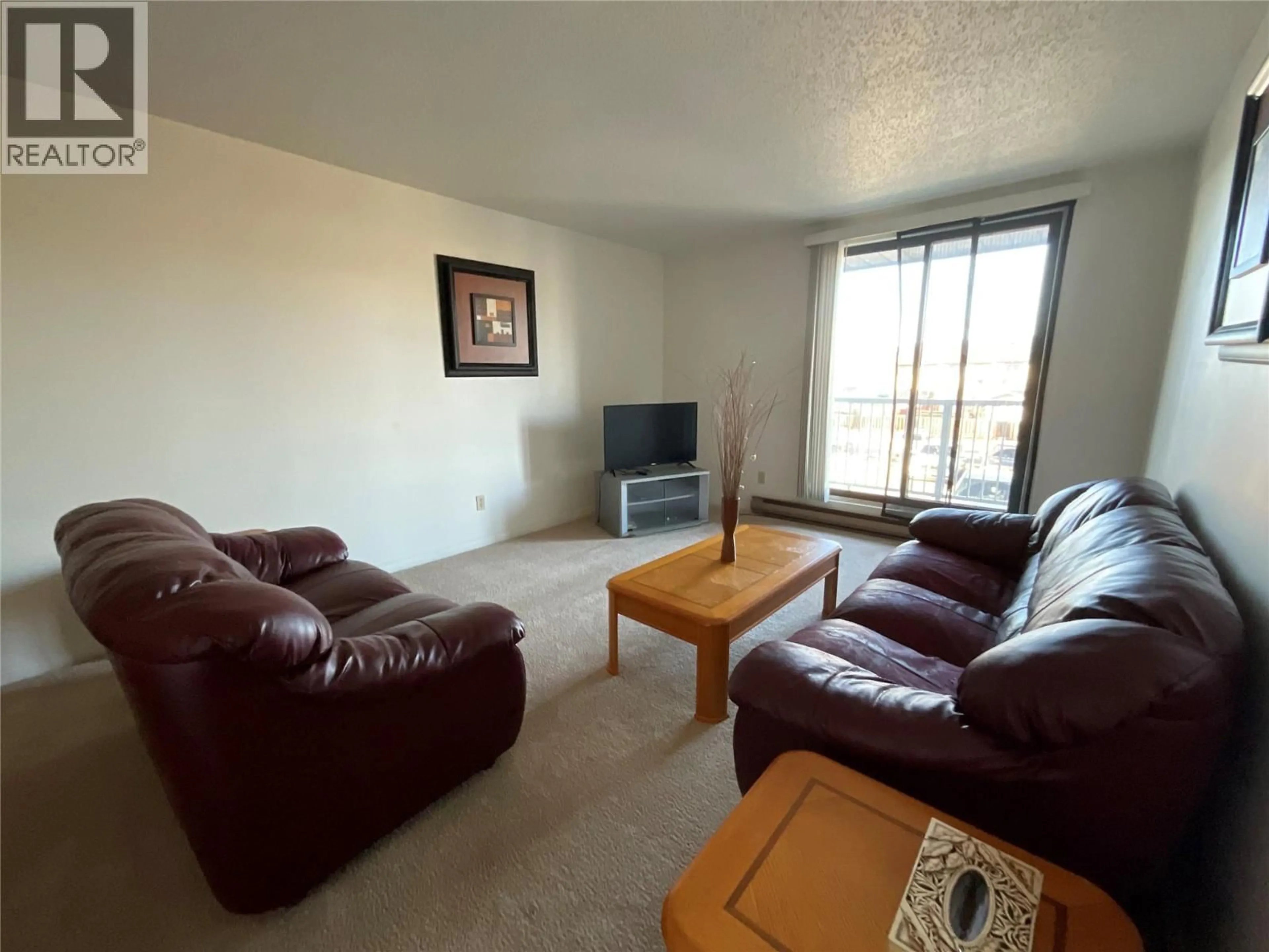 Living room with furniture, unknown for 202 - 212 SPIEKER AVENUE, Tumbler Ridge British Columbia V0C2W0