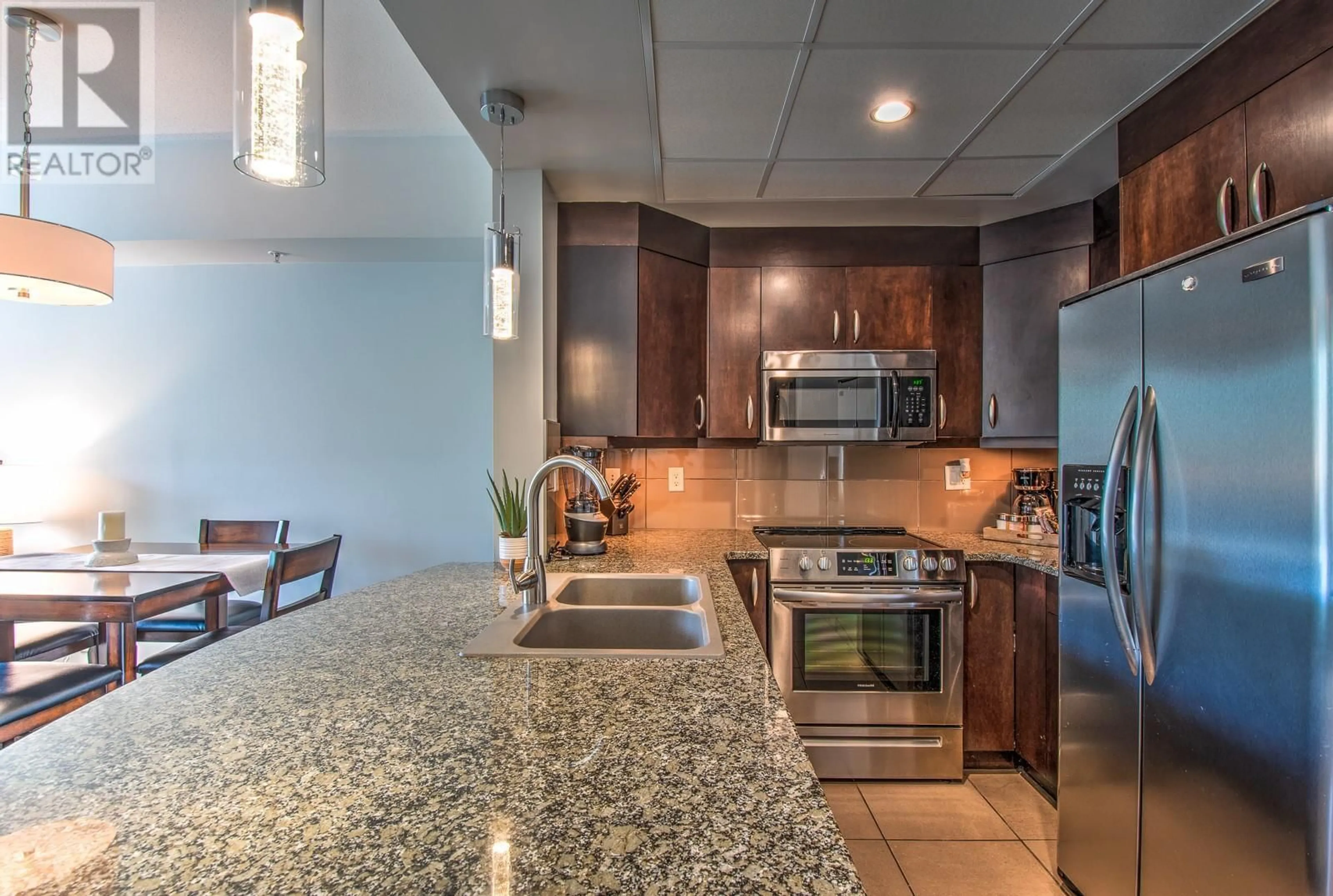 Open concept kitchen, ceramic/tile floor for 1228 - 7343 OKANAGAN LANDING ROAD, Vernon British Columbia V1H2J6