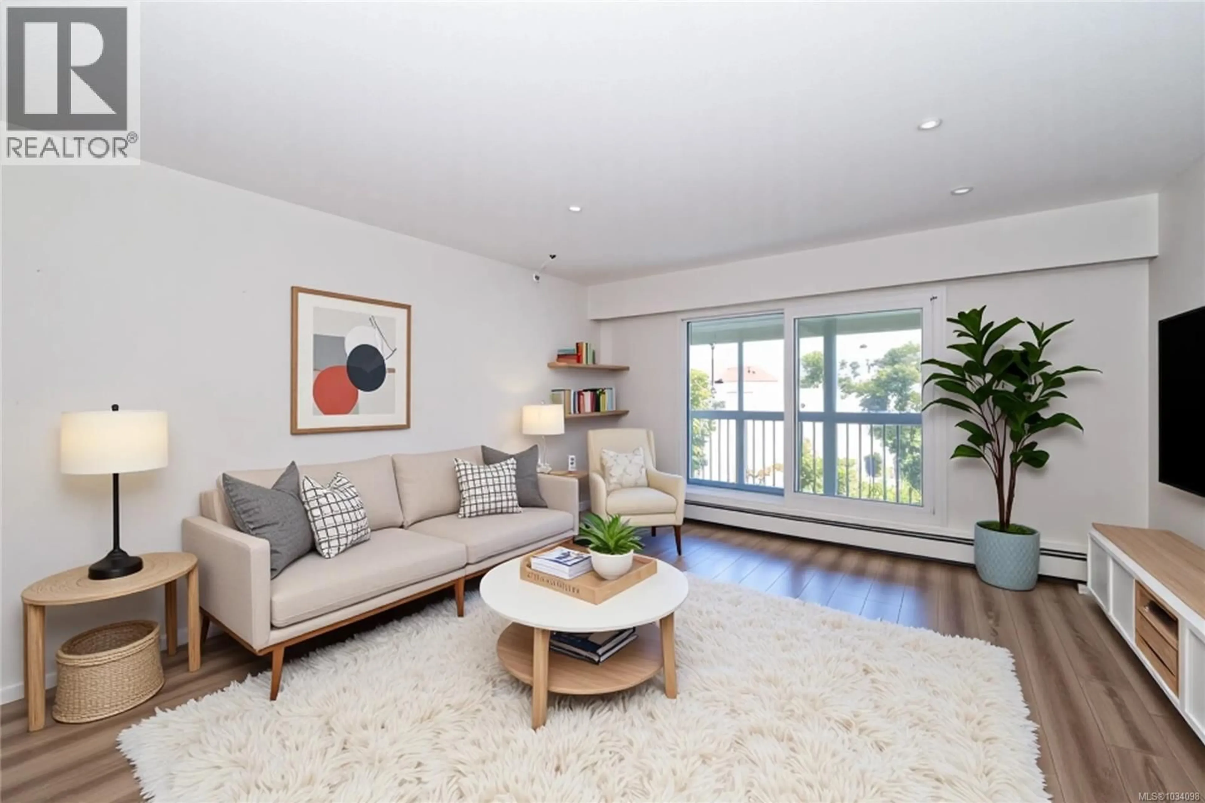 Living room with furniture, wood/laminate floor for 401 - 1188 YATES STREET, Victoria British Columbia V8V3M8