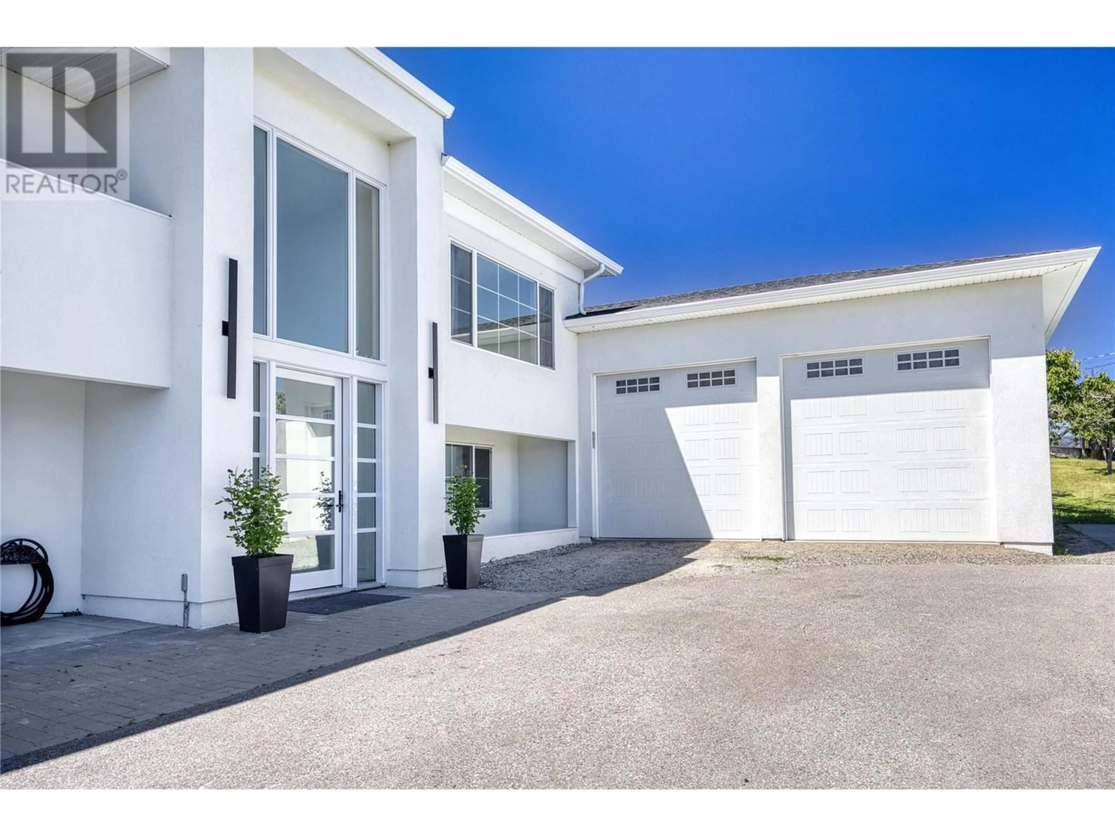 Home with vinyl exterior material, street for 2340 THACKER DRIVE, West Kelowna British Columbia V1Z1V8