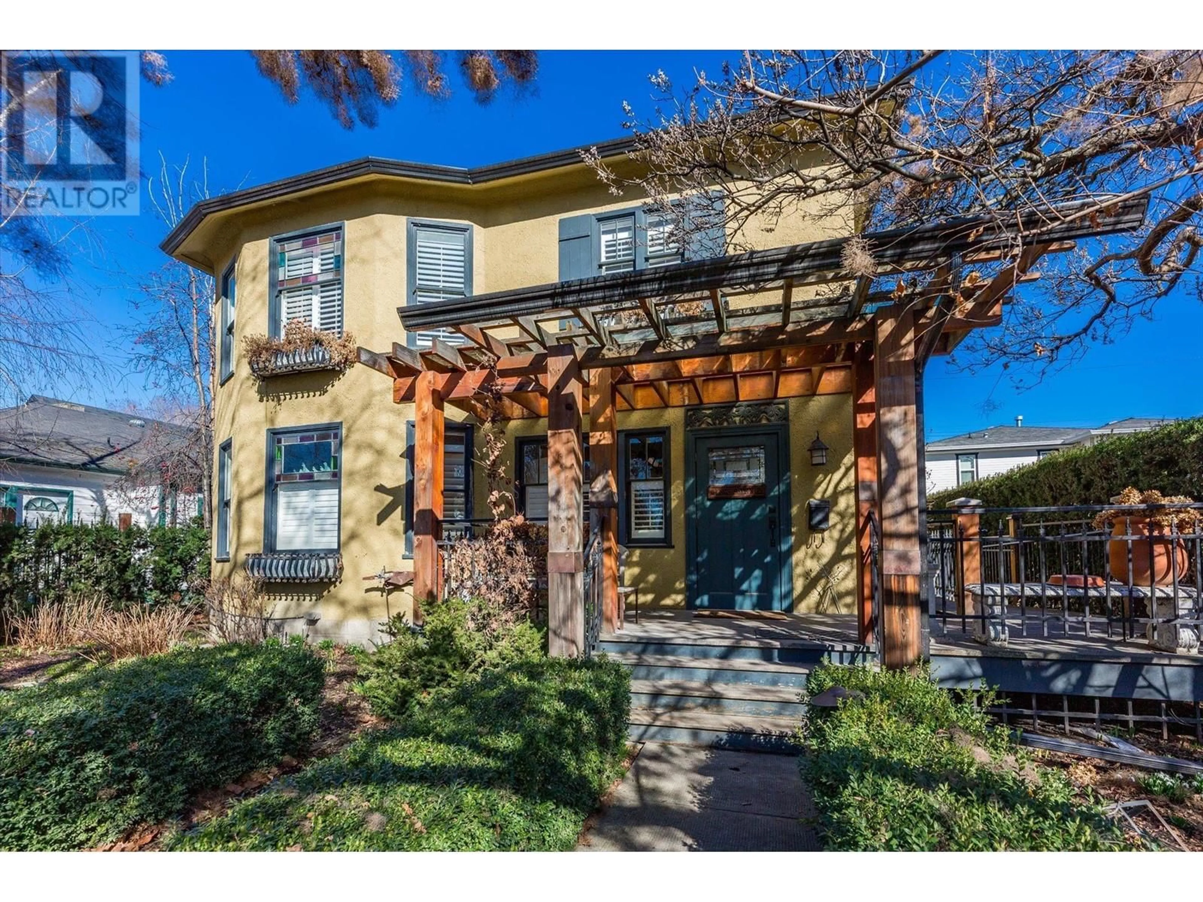 Home with brick exterior material, street for 770 BERNARD AVENUE, Kelowna British Columbia V1Y6P5