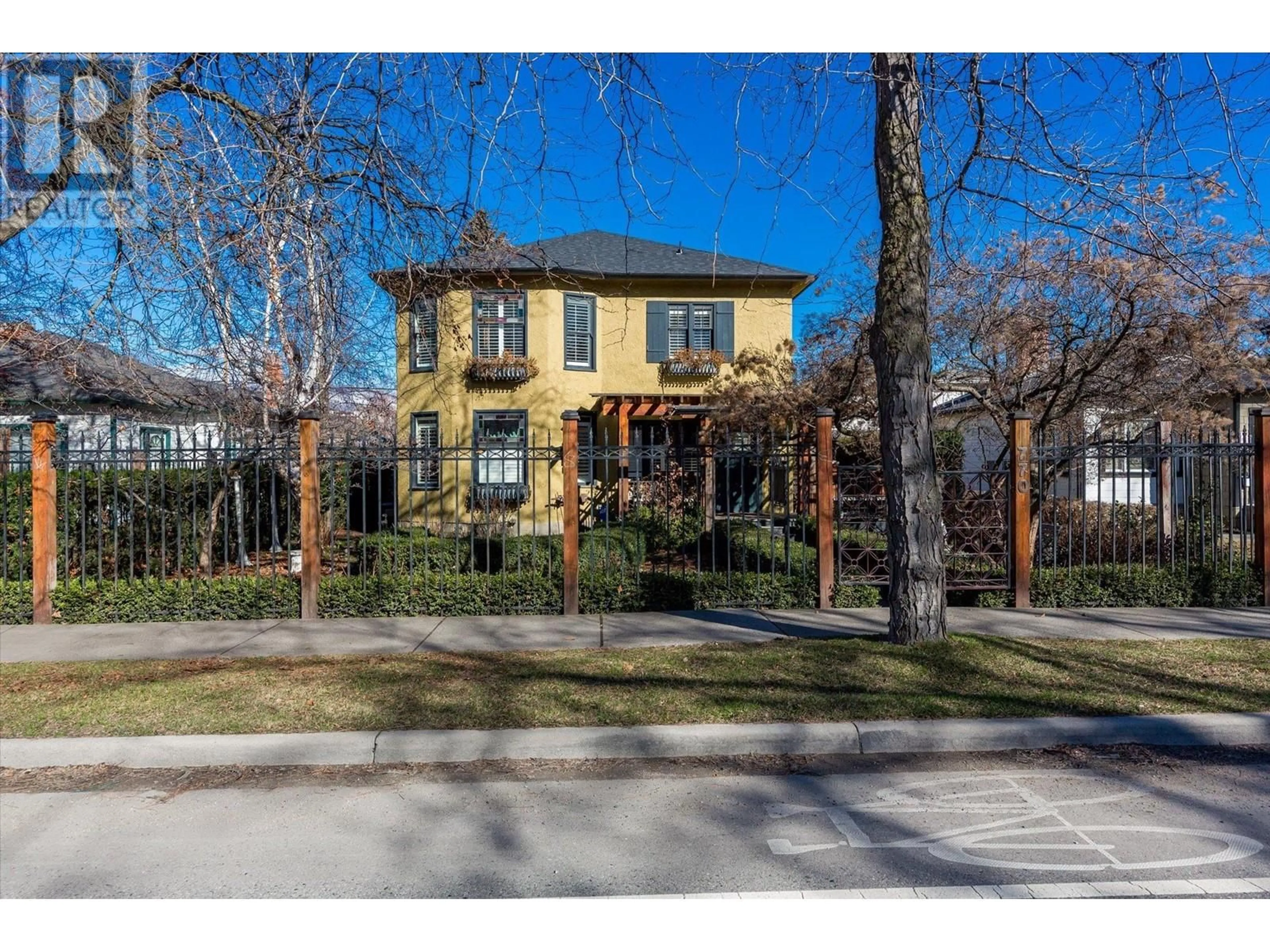 Home with brick exterior material, street for 770 BERNARD AVENUE, Kelowna British Columbia V1Y6P5