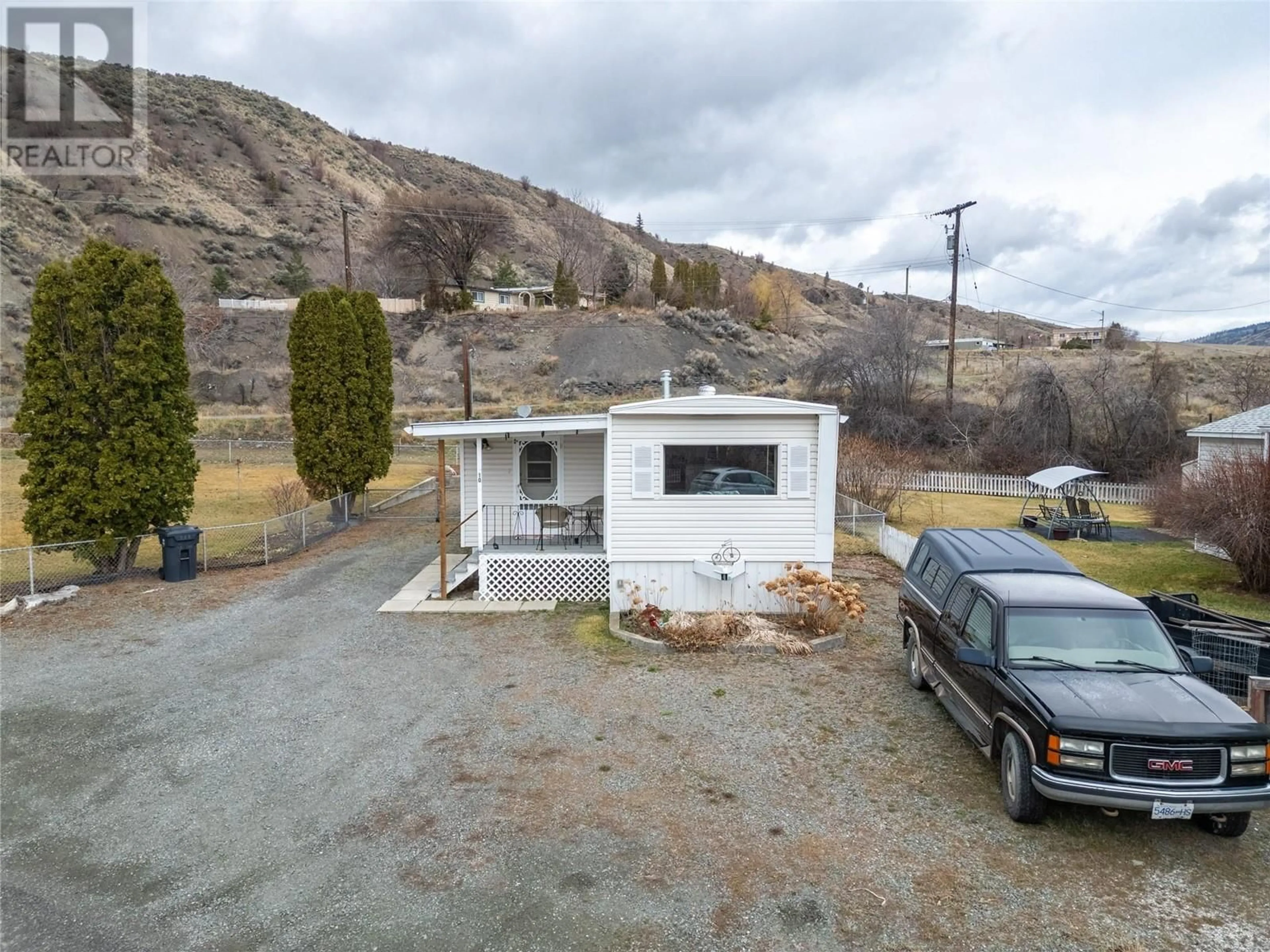A pic from outside/outdoor area/front of a property/back of a property/a pic from drone, mountain view for 10 - 1321 OLD CARIBOO ROAD, Cache Creek British Columbia V0K1H0