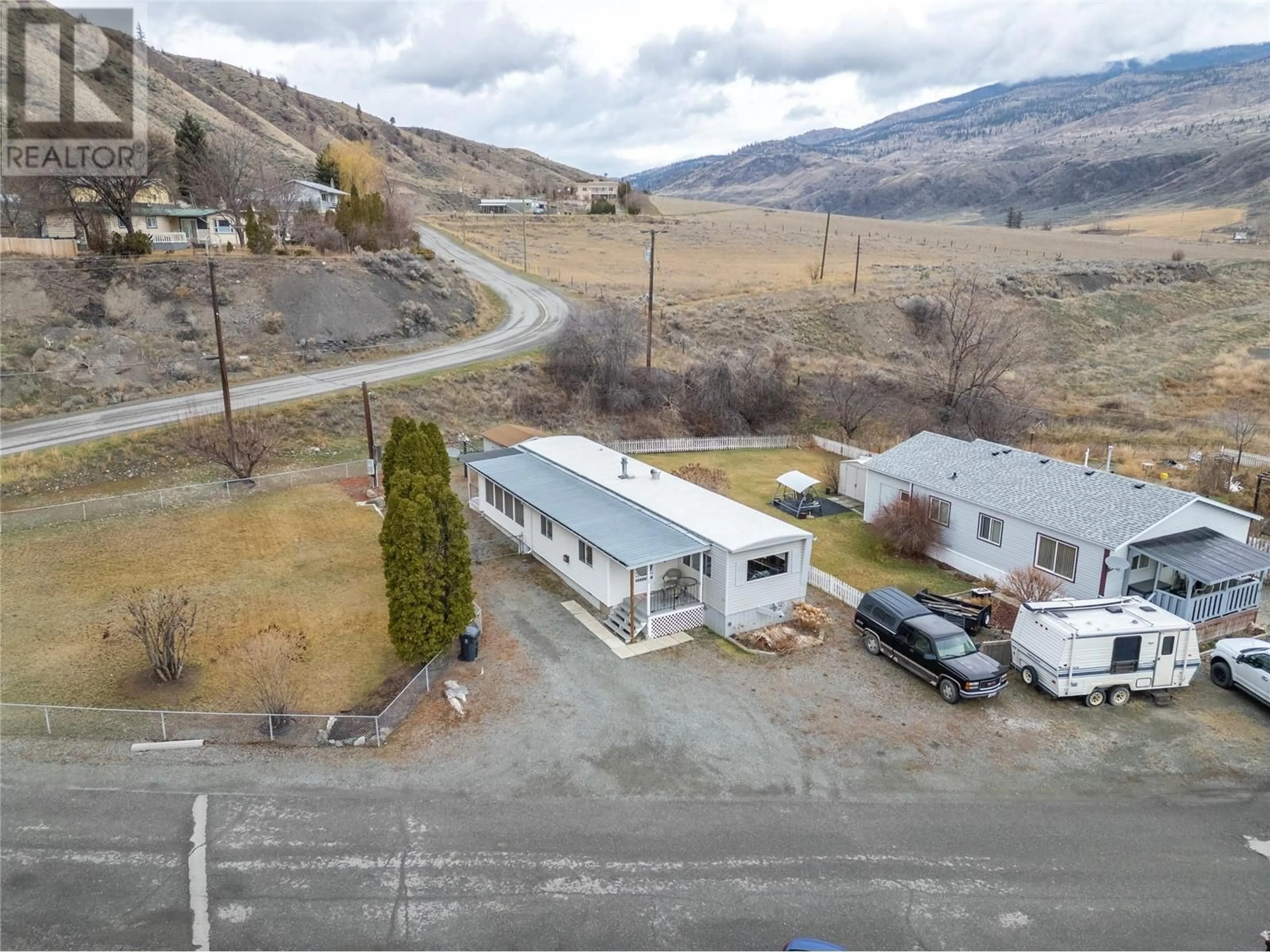 A pic from outside/outdoor area/front of a property/back of a property/a pic from drone, mountain view for 10 - 1321 OLD CARIBOO ROAD, Cache Creek British Columbia V0K1H0