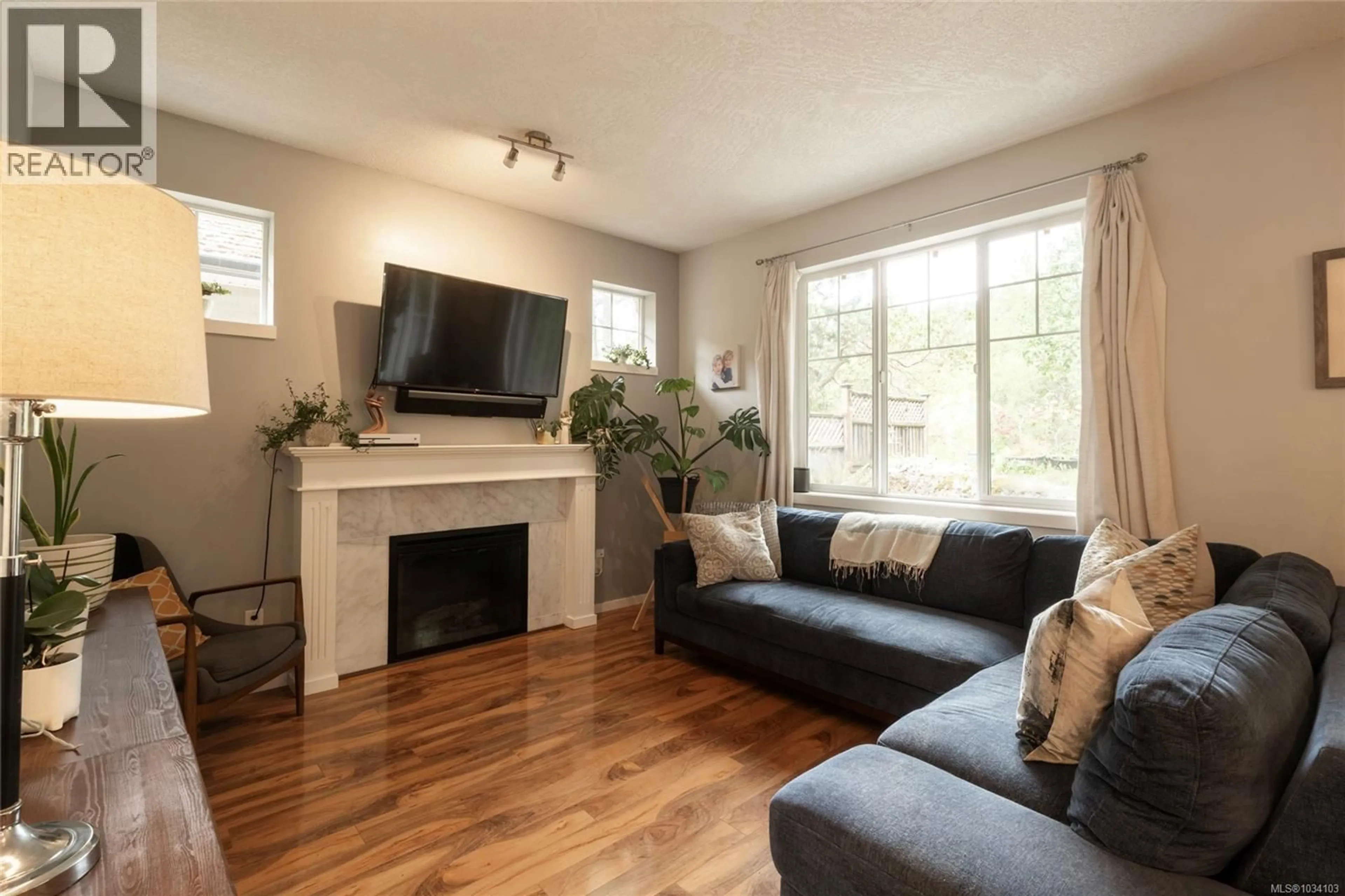 Living room with furniture, wood/laminate floor for 3584 VITALITY ROAD, Langford British Columbia V9C0E9