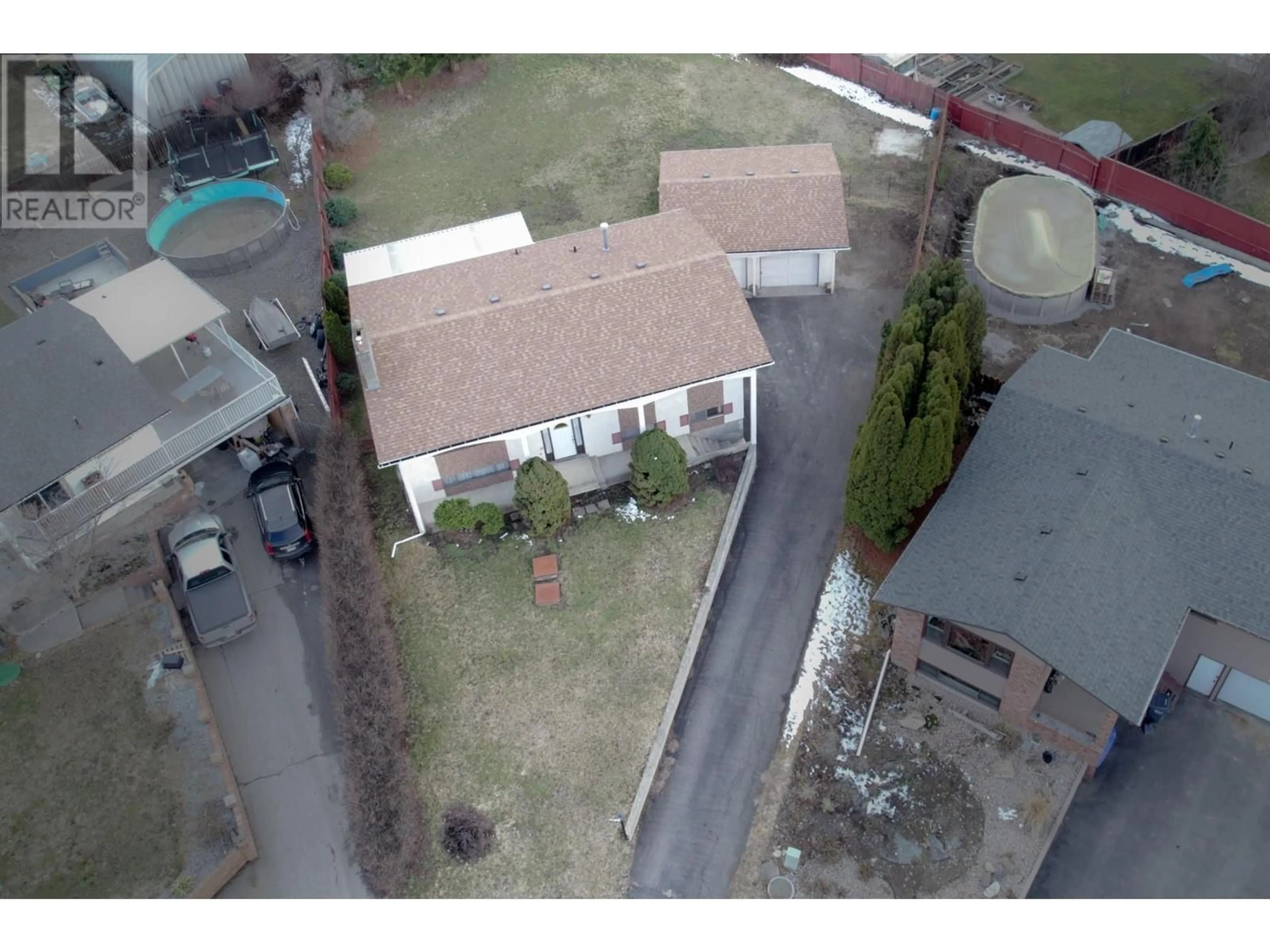 A pic from outside/outdoor area/front of a property/back of a property/a pic from drone, street for 5715 RICHARDS CRESCENT, Vernon British Columbia V1B3R1