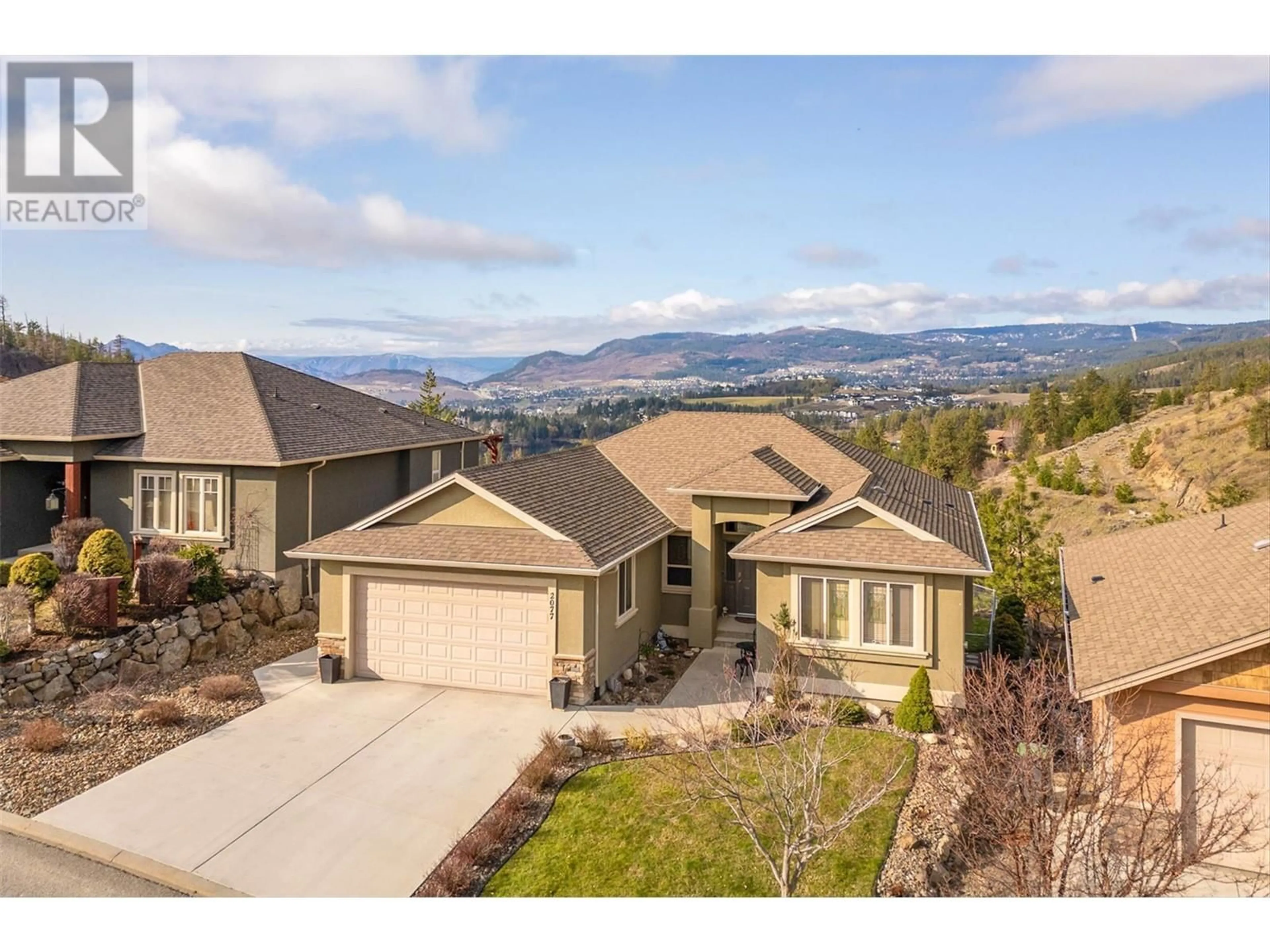 A pic from outside/outdoor area/front of a property/back of a property/a pic from drone, mountain view for 2077 CORNERSTONE DRIVE, West Kelowna British Columbia V4T2S3