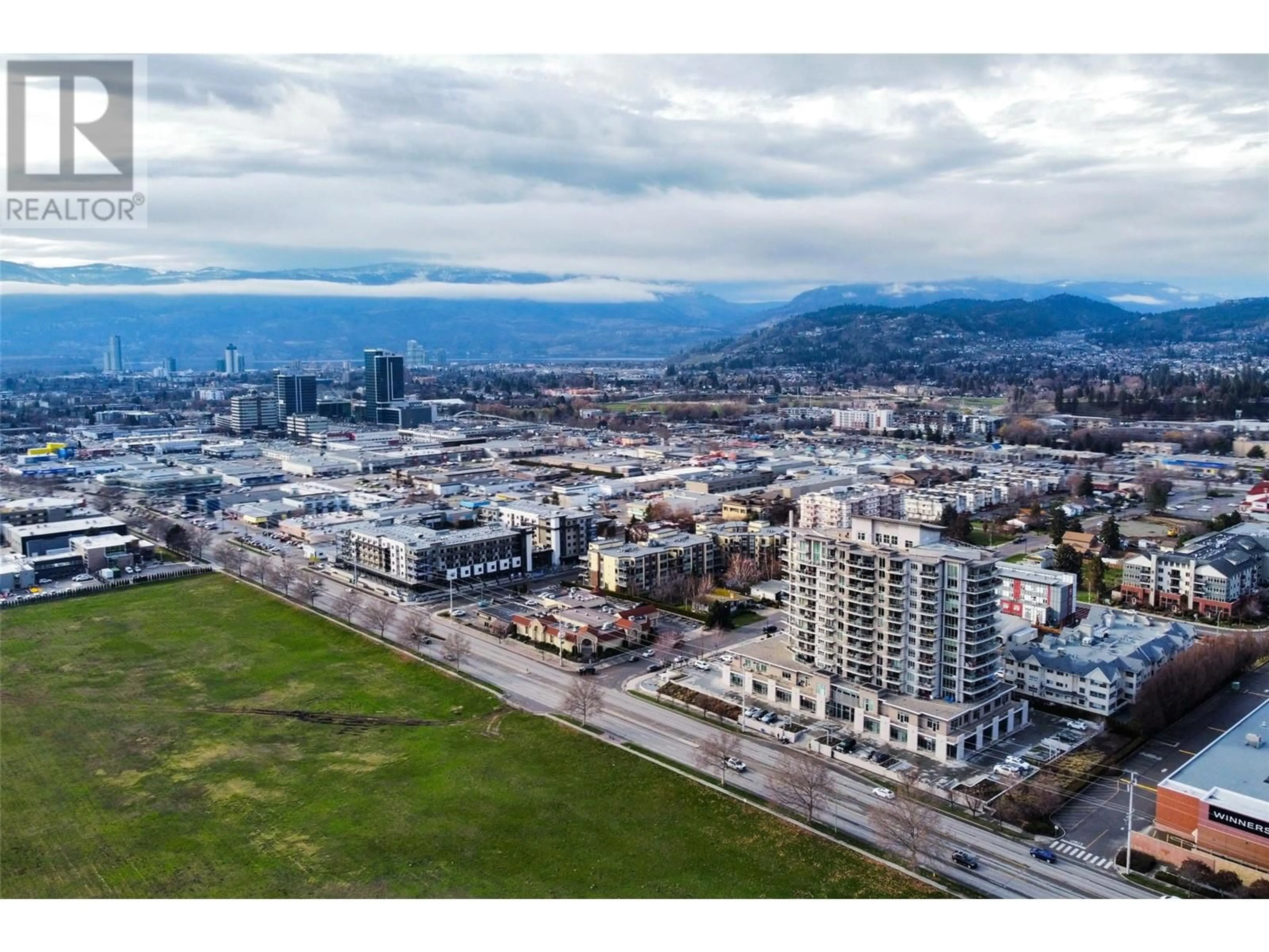 A pic from outside/outdoor area/front of a property/back of a property/a pic from drone, mountain view for 606 - 2040 SPRINGFIELD ROAD, Kelowna British Columbia V1Y9N7