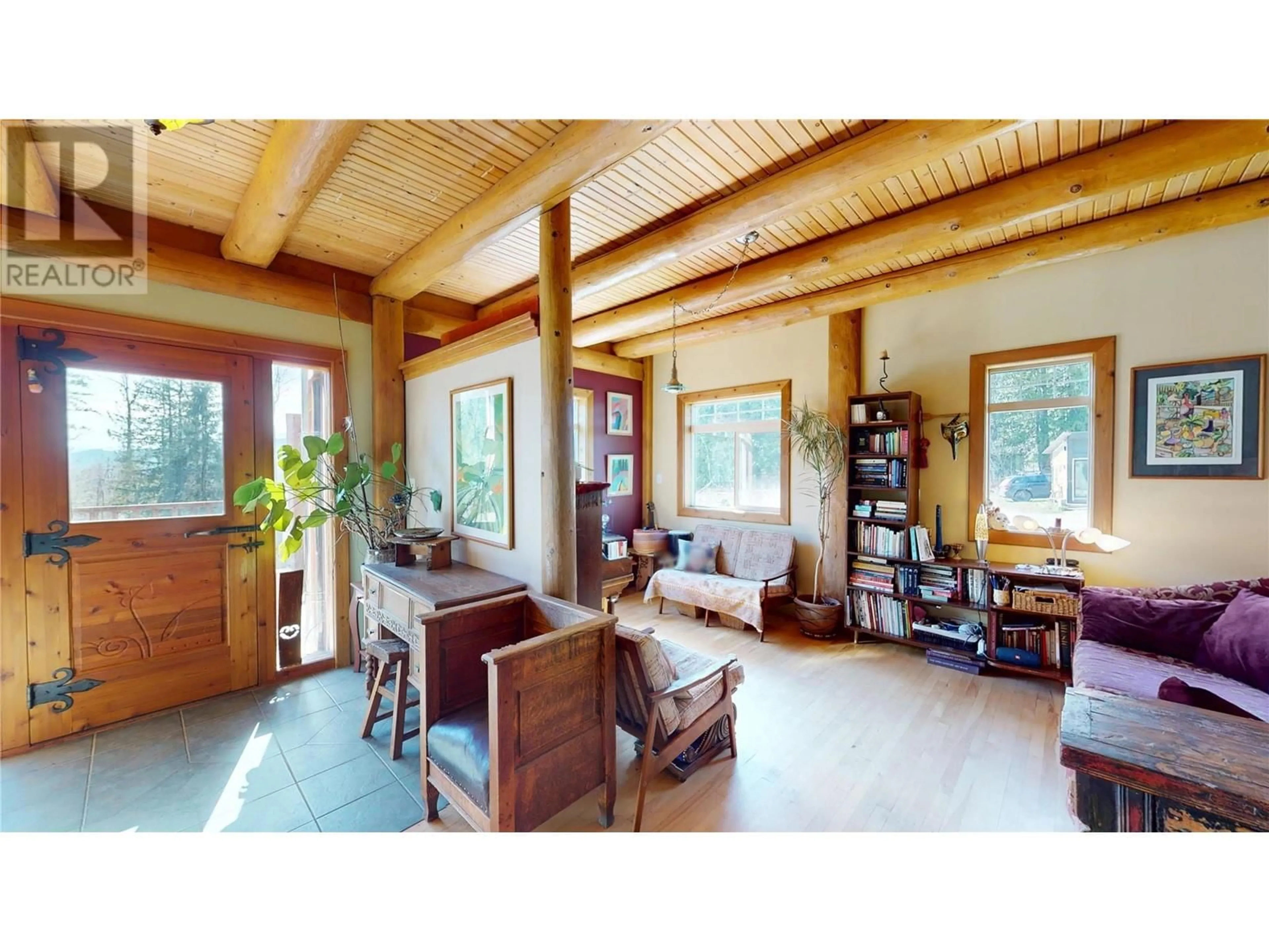 Living room with furniture, wood/laminate floor for 16370 JACOBSON ROAD, Crawford Bay British Columbia V0B1E0