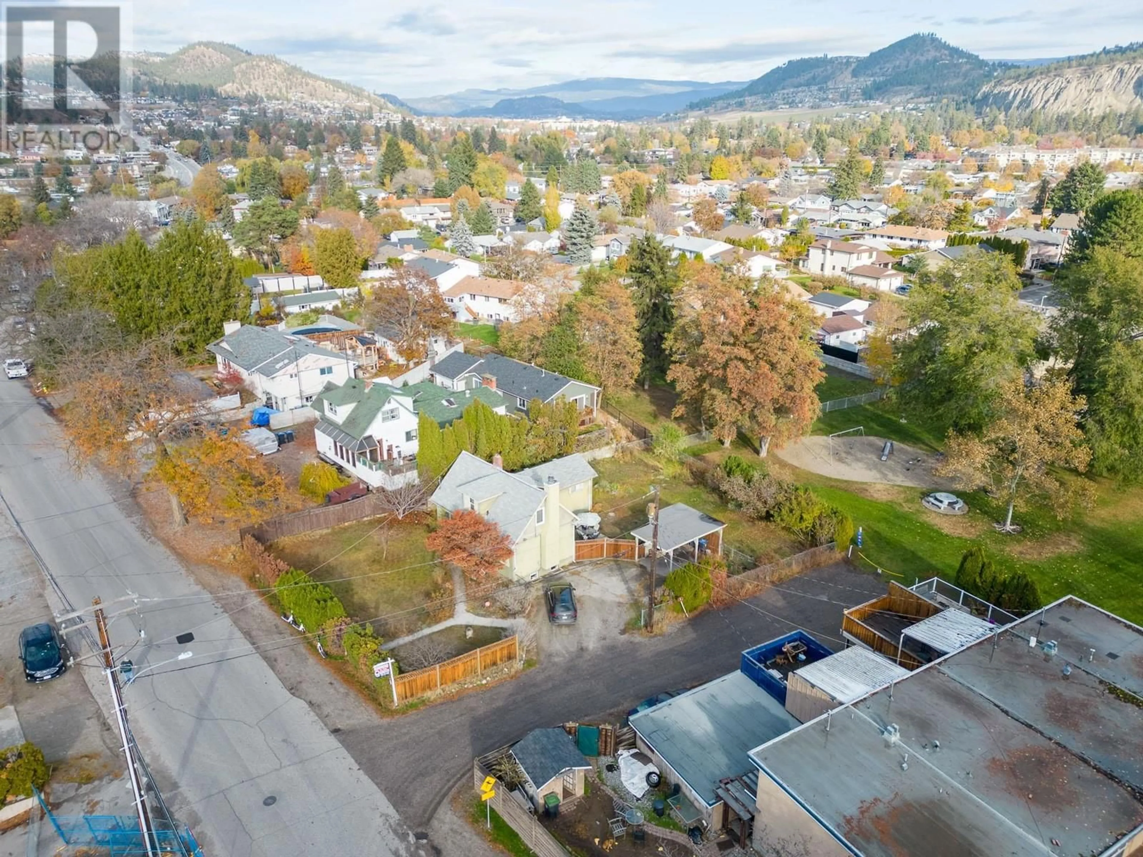 A pic from outside/outdoor area/front of a property/back of a property/a pic from drone, mountain view for 1485 HIGHLAND DRIVE SOUTH, Kelowna British Columbia V1Y3W3