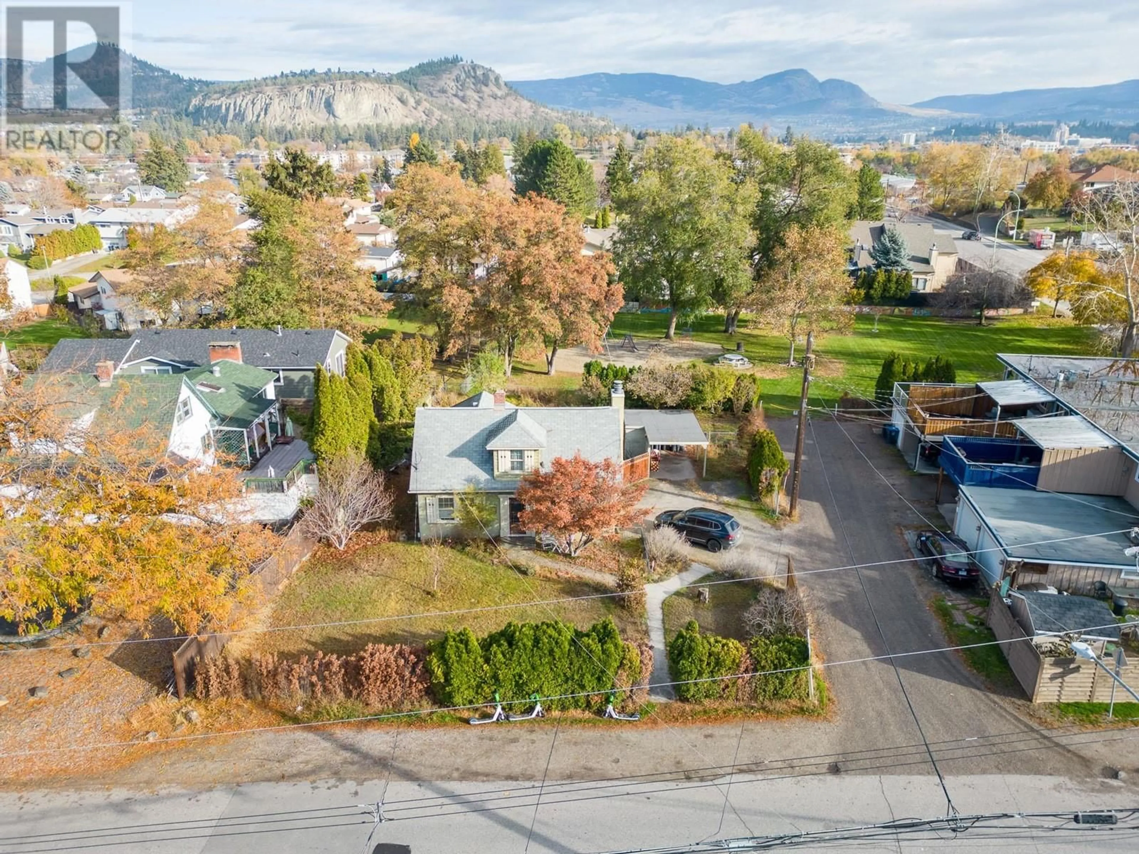 A pic from outside/outdoor area/front of a property/back of a property/a pic from drone, mountain view for 1485 HIGHLAND DRIVE SOUTH, Kelowna British Columbia V1Y3W3