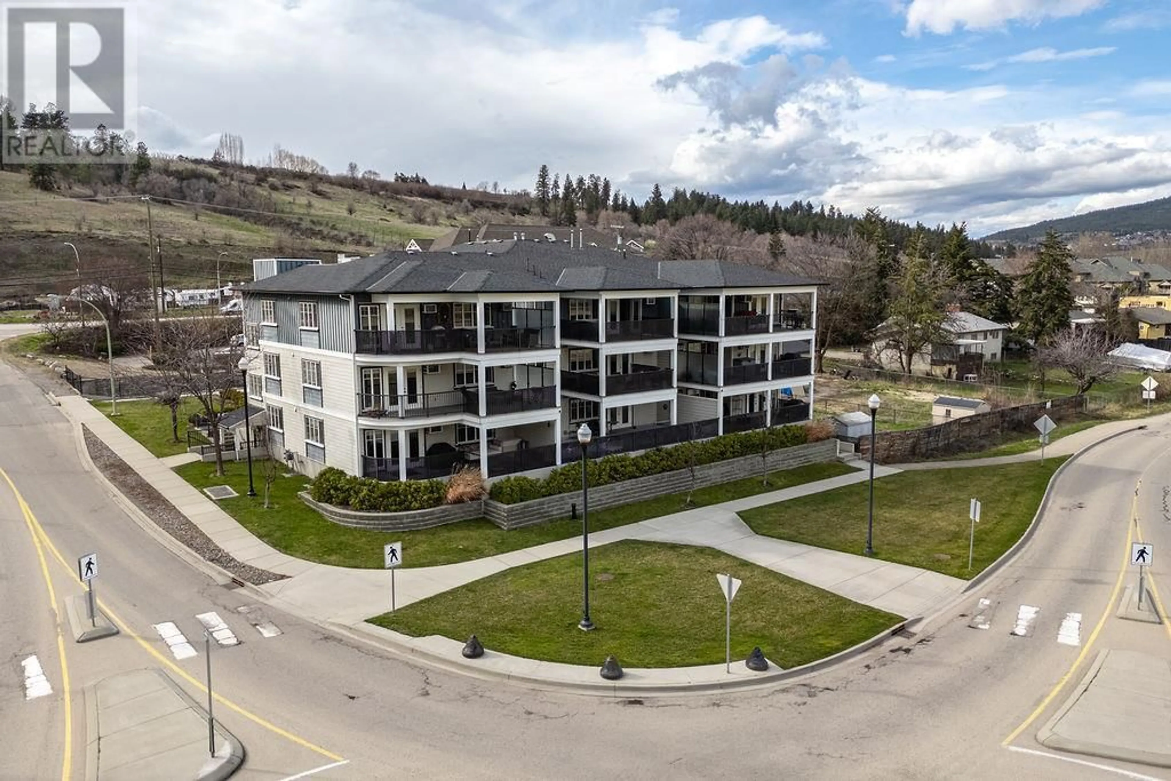 A pic from outside/outdoor area/front of a property/back of a property/a pic from drone, mountain view for 101 - 10529 POWLEY COURT, Lake Country British Columbia V4V2S2